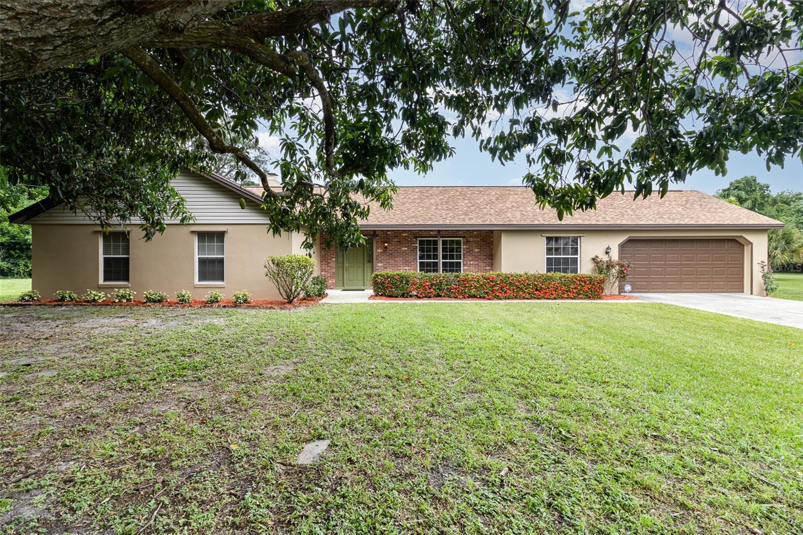 Rare opportunity for a 4/2 pool home in desirable South Merritt Island Hilltop Manor subdivision. Well-maintained home located on .57 acres at the end of a quiet cul-de-sac. Living room features a wood-burning brick fireplace and sliding glass doors that lead out to the oversized screen-enclosed pool. Large lot boasts manicured landscaping shaded by mature mango trees. Drain lines replaced with PVC in 2025.