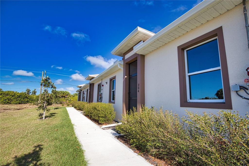 Photo of 289 Boundary Blvd #203, Rotonda West, FL 33947 (MLS # TB8484542)