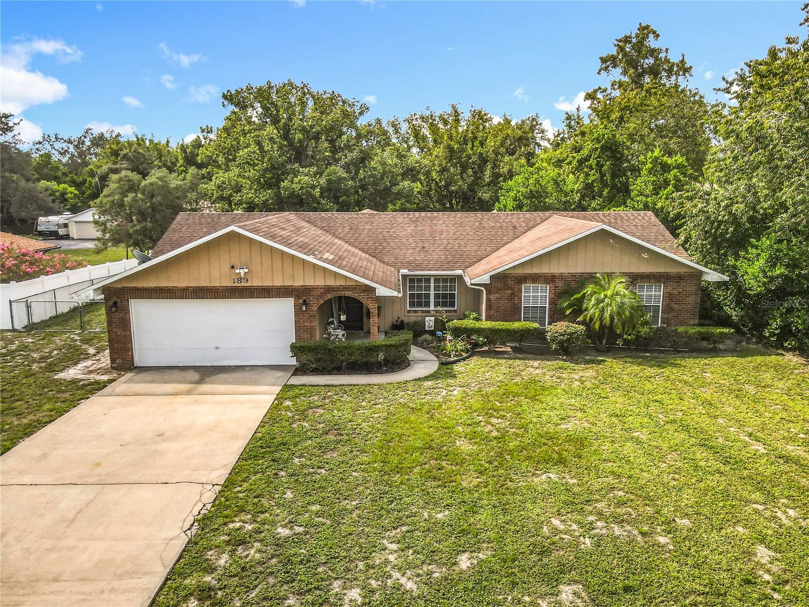 Welcome To This Charming 3-Bedroom, 2 Bath Home On A Beautiful .65 Acre Lot In The Heart Of Debary. This Property Has A Great Floor Plan Which Includes Living Room, Dining Room And Family Room With A Cozy Fireplace. Kitchen With Tile Countertops And A Decent Number Of Cabinets, Newer Refrigerator. All Appliances Stay Including Washer Dryer And Freezer. All Rooms Are Nice And Roomy, And The Owner’s Suite Features A Bathroom With Dual Sinks, Tiled Shower Stall And Walk-In Closet. From The Family Room, Step Out Into The Covered Screened Porch Where You Can Enjoy Privacy In Your Fully Fenced Backyard. One Great Feature Of This Property Is The 16x24 Outbuilding Equipped With It’s Own Window A/C Unit, Separate Electrical Panel And Att Internet Hookup. With A Little Fixing It Would Make An Ideal Workshop, Studio, Home Office Or Craft Room. Roof (2015). Drainfield (2024) This home is in a great spot and fairly close to everything you May Need. Rob Sullivan Park Is Right Across The Street. For Families, The Highly Rated Debary Elementary Is Less Than A Mile Away. If You Love Life On The Water, The Boat Launch Is Just 1.3 Miles Away Providing Easy Access For Boating, Fishing, Kayaking, And Enjoying All That The St Johns River Has To Offer And Right In The Same Spot, You’ll Also Find The Well-Known Swamp House Grill-A Local Favorite With Rave Reviews. Commuters Will Love The Easy Access To The Sun Rail Station Only 4.2 Miles Away Or I-4 Which A little Further Down The Road. Whether You Are A First-Time Buyer Looking For A Home To Grow Into Or Buyers Who Want To Put Their Style And Vision Into A Home With Solid Bones This Home Is Priced At A Great Price!
