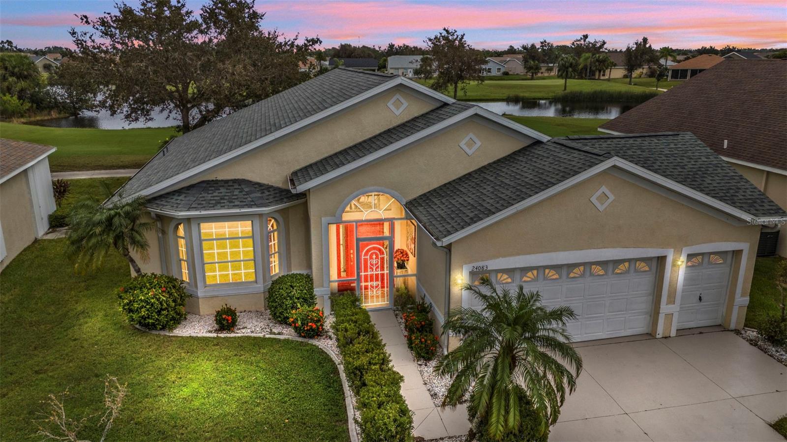 One or more photo(s) has been virtually staged. Rarely available NOTTINGHAM floor plan in the gated golf course/active resort of highly desirable Kings Gate, a 55+ community (evacuation zone D - have not been under any evacuation order, NOT in a flood zone - no flood insurance required). This 2 1/2 CAR GARAGE home has extensive updates (AC 2021, Roof 2022, updated kitchen counters, cabinets and SS appliances from 2024, both bedrooms with updated LVP flooring and both bathrooms updated as well). Come enjoy the SENSATIONAL VIEW of the 8th and 7th holes along with the water/nature view this home provides. Step inside and you'll notice the HIGH ceilings - the large living room - before gazing out to the lanai and external paver patio along with that A+ view. The open concept floor plan connects the kitchen - living room - lanai seamlessly. To the front left is a bonus room - could be used as a 2nd TV room, an office/den or even a third bedroom depending on your lifestyle. The guest bedroom with two large closets (great for storage) has its own entrance to the guest bathroom. The master bedroom has sliders to the lanai and a master bathroom with large tub, separate shower and dual sinks. This house has a LIKE NEW feel to it with all the updates/upgrades. And if you haven't been to Kings Gate before - you're going to love the options for activity (Olympic size heated swimming pool and spa, tennis courts, pickle ball, lawn bowling, shuffle board, bocce, horseshoes, gym, billiards, library, euchre, bingo, bridge, Texas hold em, poker, mahjong and more). The onsite AND NEWLY REMODELED Lions Den restaurant and bar is super convenient and also offers Tuesday night Karaoke and monthly trivia contests. Many residents love the fact that they are just a golf cart ride away from the Winn Dixie shopping plaza that provides you access to grocery store, drug store, bank, restaurants and shopping. Want to explore outside of Kings Gate – you are minutes away from the restaurants and shops of downtown Punta Gorda and Fisherman's village. And if you want to explore more of Florida's fun spots you’re near I75 to quickly head north or south. An AWESOME and very RARE home that is totally updated with a GREAT VIEW in a PREMIER gated community needs to be on your list. Call today for a private showing and a golf cart tour of the community/amenities.
