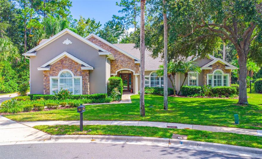 Welcome to 765 Whooping Crane Court, an exceptional custom home on a wooded cul-de-sac lot in the guard-gated community of Lake Forest in Sanford. This beautifully maintained four-bedroom, four-bath residence offers timeless craftsmanship, modern updates, and an unbeatable location within one of Central Florida’s premier neighborhoods.
Designed for comfort and versatility, this thoughtfully planned layout features two primary suites on the first floor, providing ideal accommodations for multi-generational living or extended guests.
The remodeled kitchen is a showpiece, featuring gorgeous counters, a large center island, stainless steel appliances including a professional gas range, and a wine refrigerator. Gorgeous woodwork and attention to detail are showcased throughout, complemented by hand-scraped engineered bamboo flooring in the main living areas and primary suite.
The media/theater room includes an 8.5-foot screen, projector, and six reclining theater chairs, while the family room features a hidden TV cleverly concealed in a custom cabinet beneath the picture window that raises remotely for viewing.
The home’s thoughtful design continues outdoors with a covered lanai and pool overlooking the wooded yard, all enclosed within a screened-in patio. The pie-shaped lot allows for a generous fenced side yard, offering extra privacy and space to enjoy.
Additional highlights include a three-car garage with electric vehicle hookup, double-pane windows, surround sound, built-in closet systems, updated interior paint, remodeled guest bath, and LED lighting. Major updates include a new roof and A/C (2019), new water heater (2023), and new salt cell for the pool (2025).
Residents of Lake Forest enjoy resort-style amenities including a 10,000-square-foot clubhouse with fitness center, junior Olympic-sized pool and heated spa, playgrounds, pickleball and tennis courts, and a 55-acre private spring-fed lake with fishing pier. Conveniently located near I-4, 417, and all that Central Florida has to experience, Lake Forest is more than a neighborhood—it’s a lifestyle. Once you move in, you’ll never want to leave.