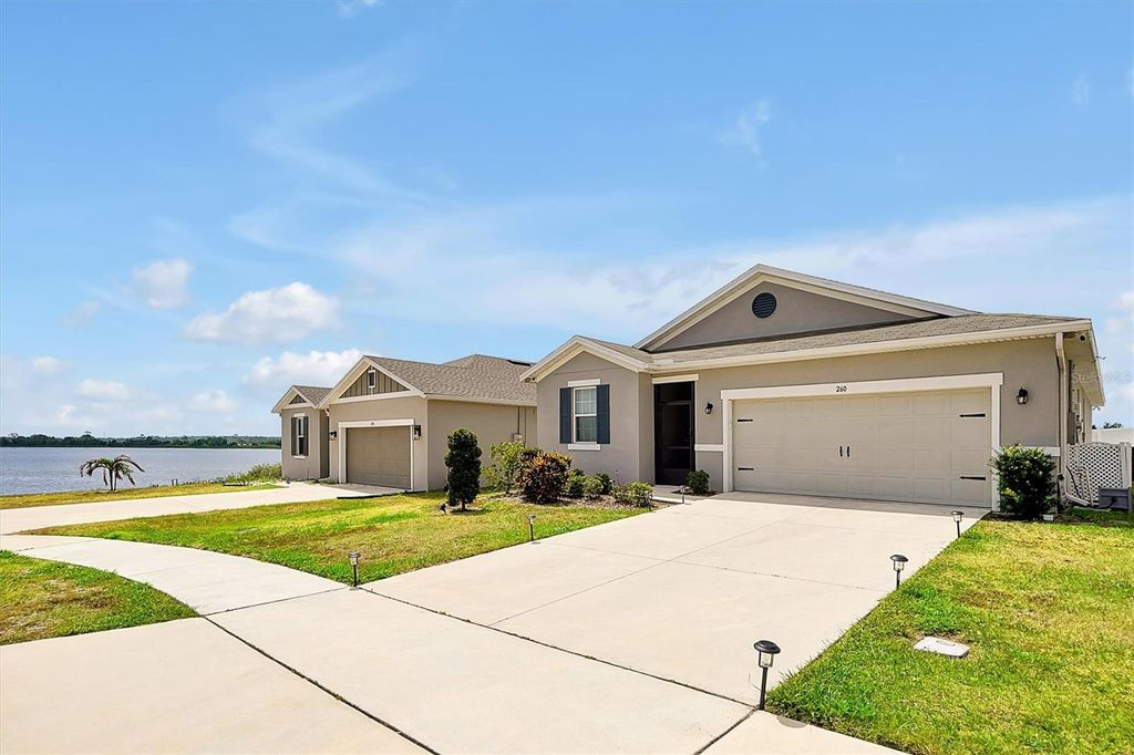 Photo of 260 Lake Smart Circle, Winter Haven, FL 33881 (MLS # O6301547)