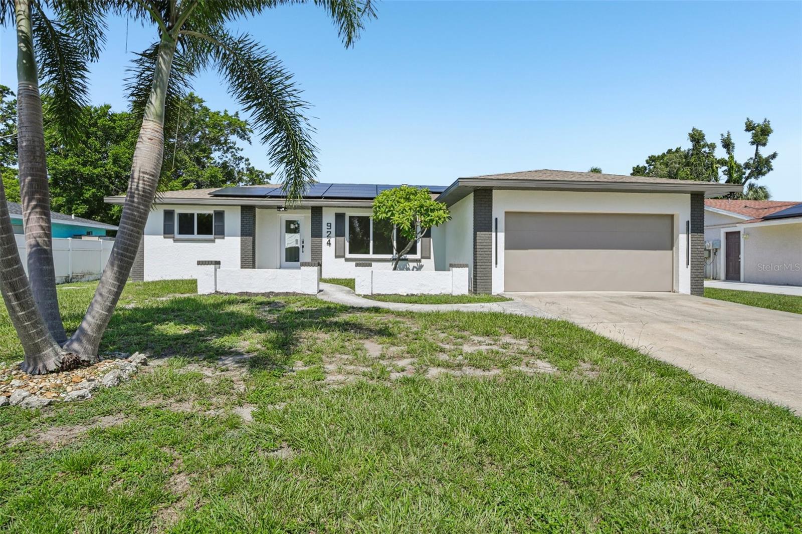 Welcome to this beautifully fully remodeled home nestled in the desirable Bonnie Lynn Estates community of Northwest Bradenton. This 3-bedroom, 2-bathroom residence offers 2,111 square feet of thoughtfully updated living space and a spacious 2-car garage. From the moment you step inside, you’ll appreciate the attention to detail and modern upgrades throughout. The heart of the home is the stunning new kitchen, featuring a large island, quartz countertops, brand-new KitchenAid appliances, a dry bar with wine racks, and stylish lighting and fixtures. Engineered wood flooring runs throughout the home.
Peace of mind comes with numerous structural and mechanical upgrades, featuring all-new hurricane impact windows and backyard slider, all installed with permits. The garage is equipped with a brand-new Steelback hurricane-rated door and motor, also fully permitted. A 2024 Trane 5-ton HVAC system provides reliable comfort and includes climate control for the garage—ideal for a workshop, gym, or hobby space. The roof was replaced in 2017, and the property also features a fully owned solar system—no lease or loan to assume. The backyard is fully fenced, offering a private outdoor retreat perfect for relaxing, entertaining, or pets.
Located just minutes from Robinson Preserve, DeSoto National Memorial, top-rated schools, and the beautiful Gulf beaches, this move-in-ready home combines quality, comfort, and convenience in one of NW Bradenton’s most established neighborhoods. Don’t miss the opportunity to make this beautifully upgraded home your own!