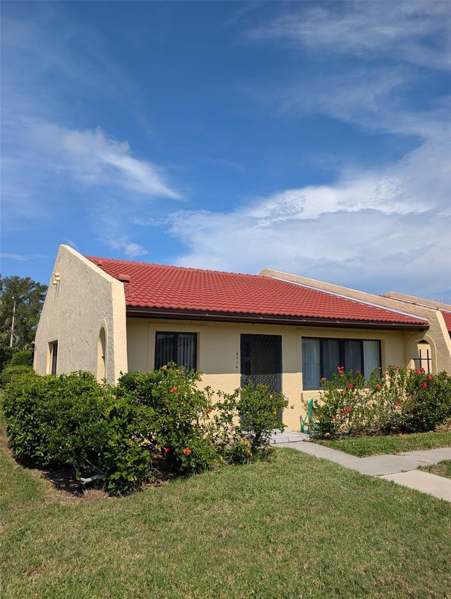 Great 2 bed 2 bath end unit condo with extra windows on the south side letting great sunlight in. in the popular Meadowcroft community. Vaulted ceilings in dining and living space. Kitchen with newer cabinets. Each bedroom with its own bathroom and walk-in closet. Long version lanai with storage closet. Dedicated covered parking spot, clubhouse with events and activities, swimming pool, shuffleboard, tennis/pickleball courts.