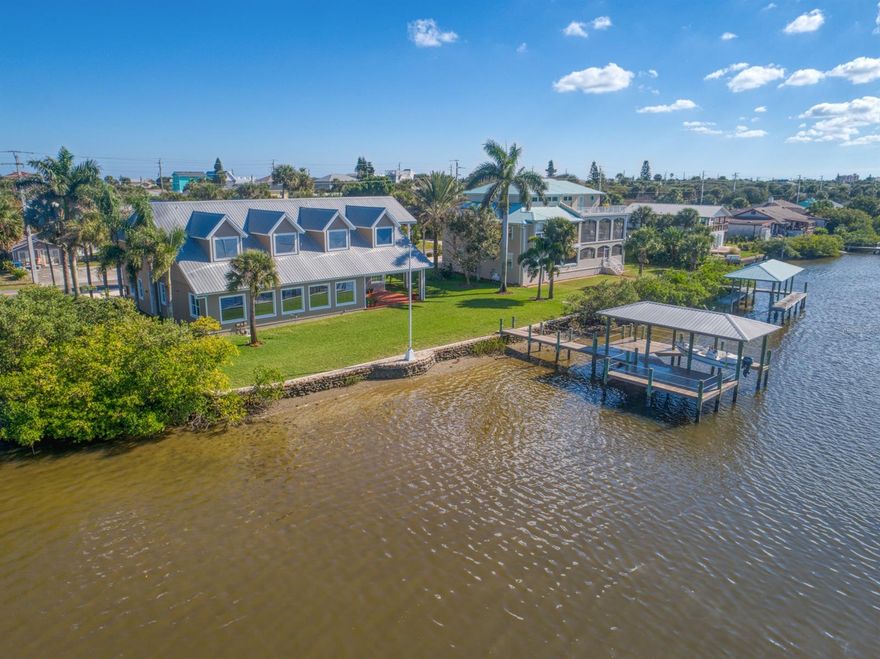 PARADISE FOUND!!!!!!! This MAGNIFICENT & ELEGANT 4BR/4.5 BA RIVERFRONT SHOWPLACE BUILT IN 2006 boasts 130' OF RIVER FRONTAGE & defines the WOW FACTOR!!!!!!! Located in quaint WILBUR BY THE SEA steps to the pristine NO DRIVE BEACH!! This IMMACULATE ONE-OWNER HOME has 5,406 SQ. FT. of luxurious living area with JAW DROPPING VIEWS from every room!! The property includes a COQUINA ROCK SEAWALL with walkway, Coquina platform & majestic 25' flagpole! The 30' BOAT HOUSE with 10' x 12' COVERED DECK & 12,000 LB LIFT is perfect for the boating/fishing enthusiast!! Enter the GRAND 10' x 10' FOYER & your eyes focus on the EXPANSIVE OPEN FLOOR PLAN & GREAT ROOM with GAS FIREPLACE which is PERFECT FOR ENTERTAINING & has an IMPRESSIVE WALL OF WINDOWS capturing an ABUNDANCE OF NATURAL LIGHT!! ;Water: City