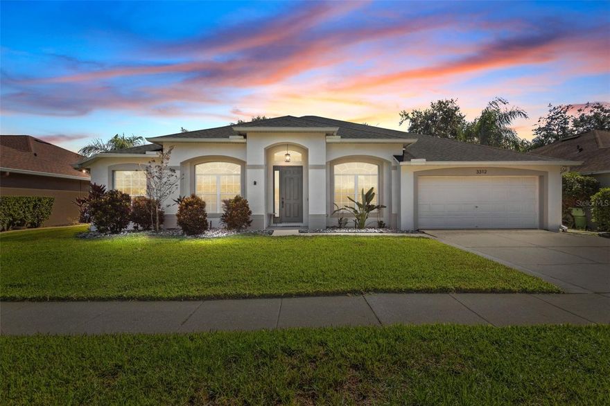 One or more photo(s) has been virtually staged. Set inside the gated Ashmonte village of the Oakstead community, this 4-bedroom, 3-bath, 2-car garage pool home blends indoor-outdoor living with a convenient Land O’ Lakes location. Less than a mile from the neighborhood clubhouse and Oakstead Elementary, and just 1.4 miles to Publix, this address offers quick access to shopping, dining, and the Suncoast Expressway for easy commuting to Tampa.

The screened lanai was designed for outdoor enjoyment, featuring a solar-heated pool, extended covered patio area, and lush bamboo landscaping that provides natural privacy in the fenced-in yard. The pool has been recently resurfaced and updated with new tile. The pool deck was also resurfaced in 2021. A backyard playset may convey or be removed at the buyer’s preference.

Inside, high ceilings and laminate flooring flow through the main living areas (no carpet in the home). Just off the foyer, a dedicated office with built-in bookshelves offers flexible workspace, while the formal dining room showcases custom millwork and large arched windows that fill the home with natural light. The open-concept great room connects seamlessly to the pool deck through glass sliders, creating an easy indoor-outdoor transition ideal for everyday living or entertaining.

The adjacent kitchen features granite countertops, white cabinetry, brand-new stainless-steel appliances (never used), a gas range, and a spacious dining nook overlooking the pool. The primary suite sits privately on one side of the home and includes lanai access. It features an upgraded en-suite bathroom with dual sinks, a frameless glass shower, and a walk-in closet. On the opposite side of the home, three additional bedrooms and two updated full baths provide flexible guest or multi-use options. One bath doubles as a pool bath with direct lanai access for convenience.

Recent updates include a roof replaced in 2019 and new kitchen appliances.

Residents of Oakstead enjoy access to community amenities including a clubhouse, resort-style pool, fitness center, tennis and basketball courts, playgrounds, and walking trails surrounded by conservation areas and ponds. HOA fee $70 annually; CDD $1,765 annually.

Located 7.4 miles to Tampa Premium Outlets and 23.2 miles to Tampa International Airport. Includes video tour for full viewing experience. Welcome home!