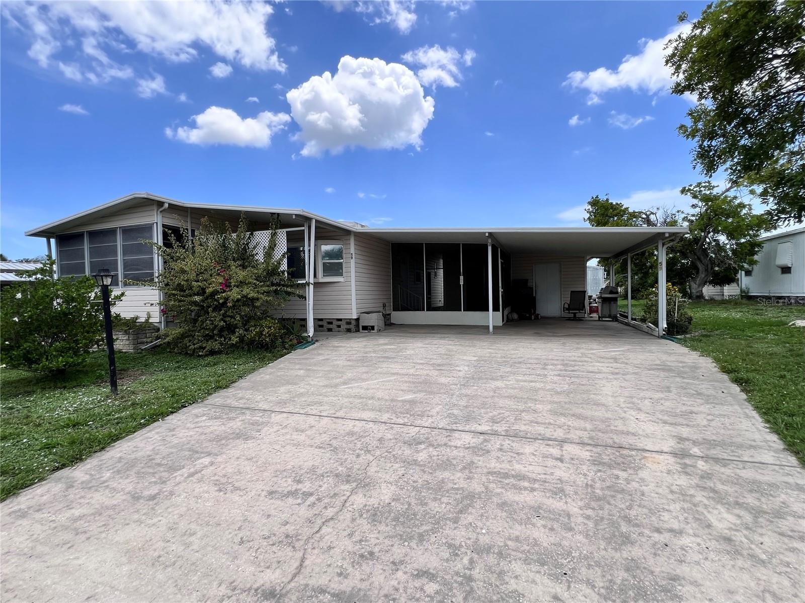 This 2-bedroom, 2-bath home is located in the non-age-restricted community of Shadow Brook. The large master bedroom offers plenty of space for a king size bed and furniture with a walk-in closet. The living room has beautiful laminate flooring and leads to a Florida Room which at the front of the home. The kitchen features a large window for natural light and plenty of counter space. This home includes a spacious double driveway, utility shed for extra storage, and tile and laminate flooring throughout. Enjoy the screened lanai for outdoor relaxation to entertain friends and family. All new windows and doors in 2022 and the roof has recently been resealed. New AC unit and new water lines in 2024. The community offers an oversized pool, shuffleboard, and a clubhouse. Conveniently located near Premium Outlet shopping and with easy access to I-75/275 for easy commutes to Tampa, St. Pete, and Sarasota. Come and enjoy Florida and all it has to offer.