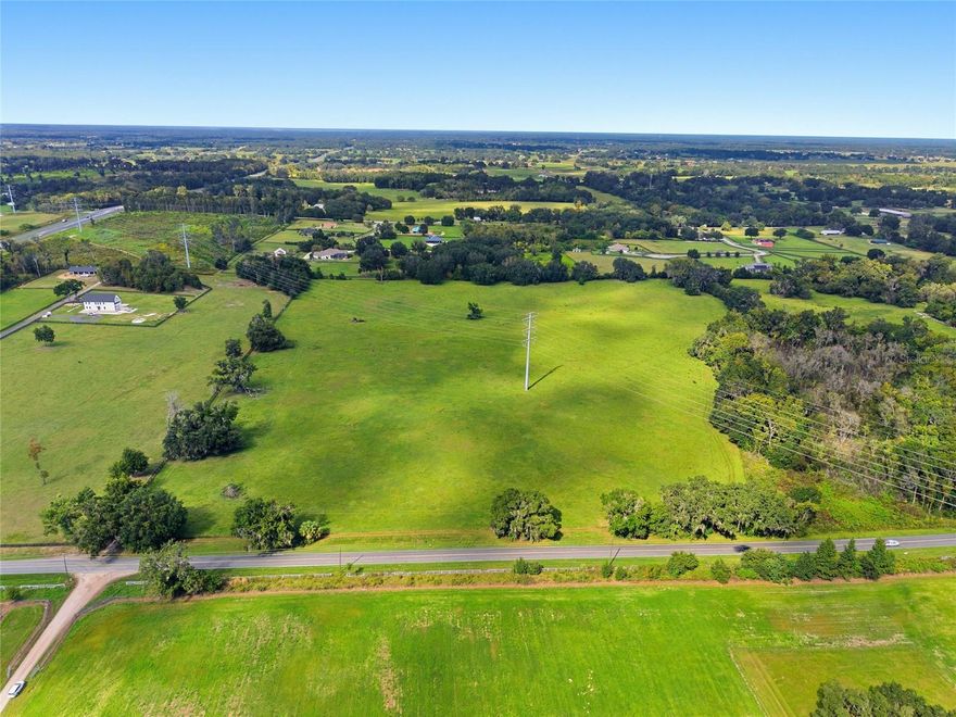 Experience the essence of Ocala's horse country with this magnificent 34-acre A1-zoned estate parcel, ideally located in prestigious North Marion County, just minutes from the World Equestrian Center. This remarkable property offers endless potential for a discerning buyer - whether you envision an equestrian estate, a private luxury retreat, or an income-producing agricultural venture. A large portion of the land is beautifully cleared, creating versatile landscape ideal for horses, cattle or farming. Towering oaks provide a shade and a timeless sense of place amongst the gently rolling terrain and a natural spring. With A1 zoning, the property accommodates a wide variety of uses - from equestrian training facilities and breeding farms to cattle or hay operations, organic farming, or even a private family compound. The setting offers both tranquility and accessibility, with Ocala's premier equestrian venues, fine dining, and boutique shopping just minutes away.