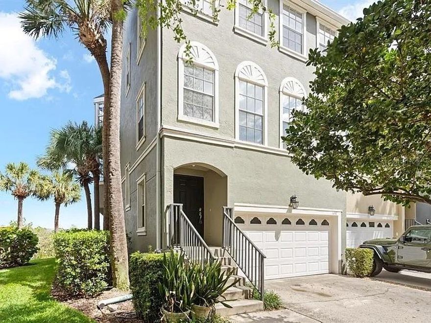 Spectacular WATERFRONT 3 Bedroom END UNIT Townhouse with direct access 2 car garage. Enjoy serene water views over Sparkman Channel from this 2358 Square Foot residence in immaculate move in condition. Versatile first floor is ideal for an at home office/gym/den with a separate custom built-in desk space, half bath and laundry with full size washer and dryer included. Bright and airy second level living and dining room open to a lovely large covered deck perfect for relaxing and watching the cruise ships pass by. Updated kitchen has granite countertops, breakfast bar,  stainless steel appliances, loads of cabinetry/storage, pantry and adjacent guest half bath. The first two levels are ceramic tile flooring, the stairway and top floor is hardwood throughout so NO CARPET! The huge top level primary bedroom also with its own private balcony facing the water includes an en-suite bathroom with dual sinks, garden soaking bathtub, glass enclosed shower and walk-in closet.Both of the secondary bedrooms are sizable and share a full hallway bathroom. Harbourside at Harbour Island is a 24 hour guard gated community beautifully landscaped with resort style swimming pool, children’s playground and numerous walking trails. Perfectly located urban setting within close proximity to Water Street, Sparkman Wharf, Benchmark Arena, Tampa Riverwalk, Downtown Convention Center and all major highways.
