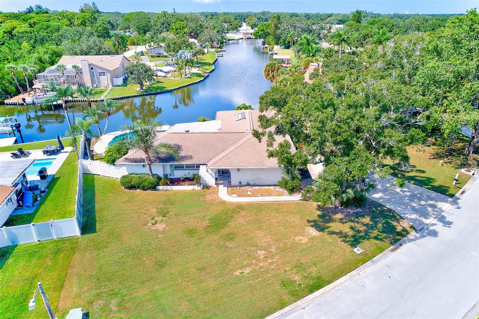 Welcome to Sharon Oaks in beautiful Clearwater. This waterfront pool home offers the opportunity to create your Florida dream home. Situated on an oversized lot along Allen's Creek, you'll enjoy direct access to Tampa Bay for boating, paddleboarding, or simply soaking in the peaceful water views from your backyard. This 4 bedroom, 3 bath home with over 2,700 total square feet invites you to personalize your ideal waterfront retreat. The home did experience flood damage from Hurricane Helene, it was promptly remediated, providing a fresh start to design the home you've always envisioned. Centrally located in the Tampa Bay Area - easy access to everything you love - two international airports, champion golf courses, vibrant downtowns including St. Pete, Dunedin, Safety Harbor and our award winning Gulf beaches. Enjoy the best of both worlds: a tranquil waterfront setting with all the conveniences of city and coastal living just minutes away. Come see the potential and start planning your ultimate Florida lifestyle today.