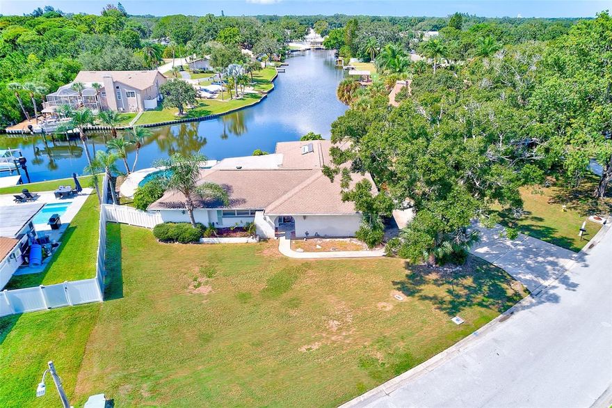 Welcome to Sharon Oaks in beautiful Clearwater.  This waterfront pool home offers the opportunity to create your Florida dream home.  Situated on an oversized lot along Allen's Creek, you'll enjoy direct access to Tampa Bay for boating, paddleboarding, or simply soaking in the peaceful water views from your backyard.  This 4 bedroom, 3 bath home with over 2,700 total square feet invites you to personalize your ideal waterfront retreat.  The home did experience flood damage from Hurricane Helene, it was promptly remediated, providing a fresh start to design the home you've always envisioned.  Centrally located in the Tampa Bay Area - easy access to everything you love - two international airports, champion golf courses, vibrant downtowns including St. Pete, Dunedin, Safety Harbor and our award winning Gulf beaches.  Enjoy the best of both worlds: a tranquil waterfront setting with all the conveniences of city and coastal living just minutes away.  Come see the potential and start planning your ultimate Florida lifestyle today.