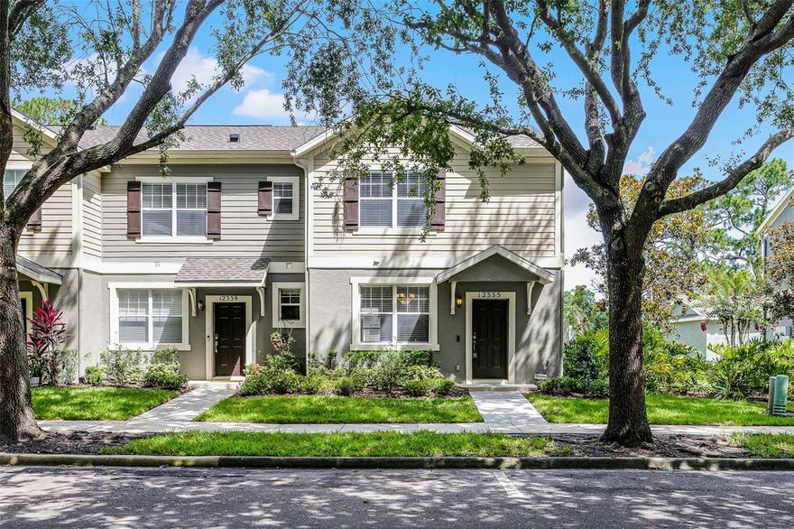 PRICE REDUCED!  Discover this spacious 2-bedroom, 2.5-bath end-unit townhome nestled in a charming Windermere community known for its tree-lined streets, sidewalks, and beautiful canopied trees. Step inside to find brand new carpet throughout and a functional layout featuring a large kitchen and great room, plus an additional flex space at the front of the home—perfect for a home office or playroom. The kitchen boasts warm-toned cabinetry and neutral finishes that create a welcoming atmosphere. Upstairs, you'll find three generously sized bedrooms and two baths, including a spacious primary suite. Enjoy Florida living with a screened-in lanai and a detached two-car garage. Located just minutes from shopping, restaurants, and the Disney Cast Member parking entrance, this home offers both convenience and lifestyle. Community amenities include a refreshing pool. Priced to sell—don’t miss this incredible opportunity!