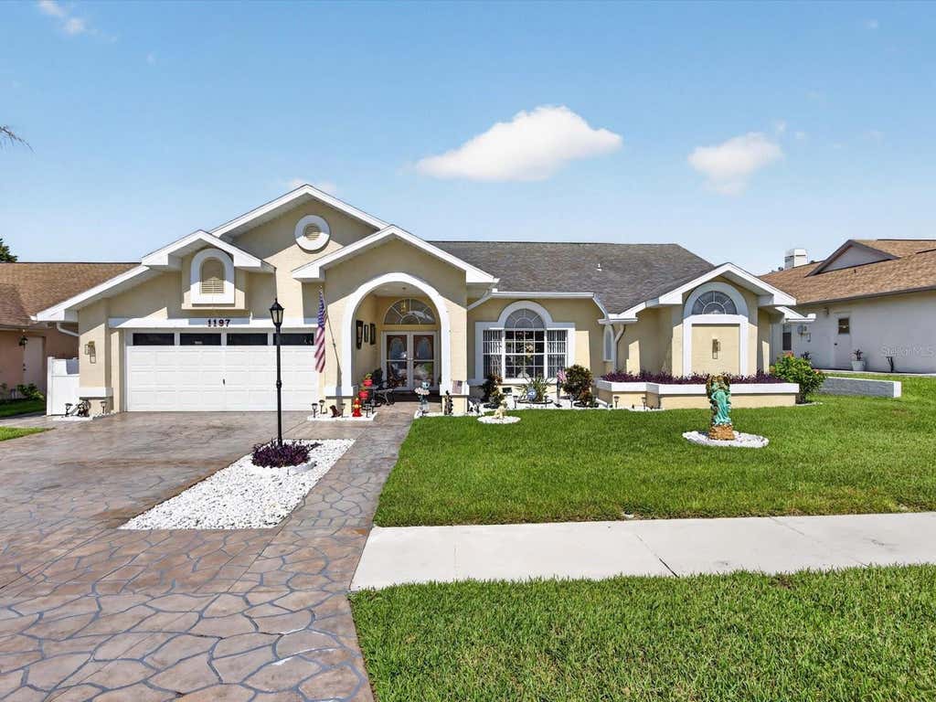 Photo of 1197 Muscovy Dr, Spring Hill, FL 34608 (MLS # O6431910)