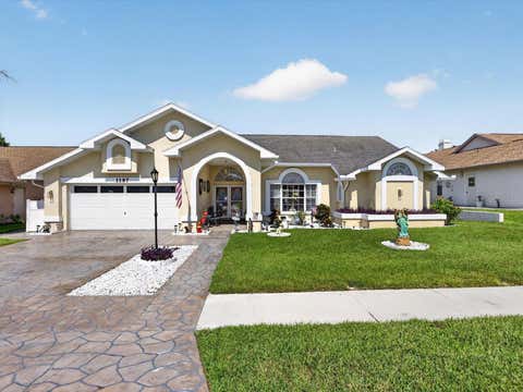 Photo of 1197 Muscovy Dr, Spring Hill, FL 34608 (MLS # O6431910)