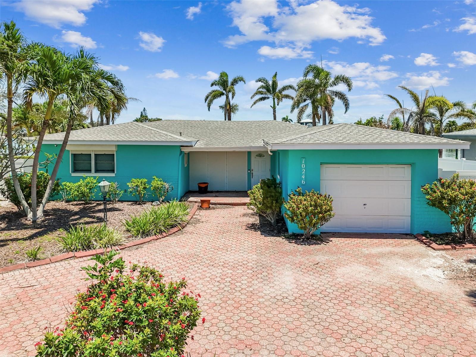 This home sustained flood damage from Hurricane Helene in 2024.
Opportunity knocks in one of the most desirable waterfront communities on Treasure Island. Just minutes from the beach, this 3-bedroom, 2-bathroom home offers endless potential for the buyer looking for boundless views on an extra wide, deep-water canal on Paradise Island. With 1988 square feet, this home features 65 feet of direct waterfront. The boaters life is at your finger tips - giving you the location and views you have been dreaming of. This canal is larger in width in respect to the homes across the water and has deep water for your large boats.
Out back, you'll find tropical foxtail palms, a Trex dock 32' in length by 12' in width, set up with water, electric, an 11,000 lb. lift, and built in seating for watching those amazing sunsets! This property is perfect for those looking to build or even restore a boat lovers retreat with scenic water views featuring magnificent sunsets and DEEP water for your water toys. Whether you’re an investor seeking a renovation project or looking to make this home your own, PARADISE is waiting.