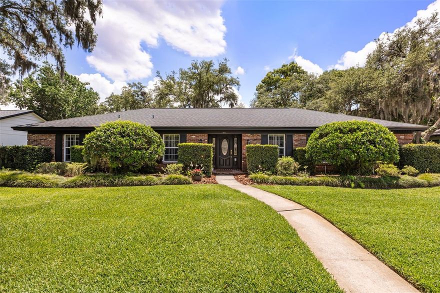 Welcome to La Floresta — one of Altamonte Springs' most exclusive and ESTABLISHED NEIGHBORHOODS (with NO HOA) where homes rarely come available. If you've been waiting for the right one, this is it. Offered by the ORIGINAL OWNER, this stately 4 bedroom, 2.5 bath SINGLE-STORY HOME makes an immediate impression with its CLASSIC BRICK FACADE and impeccably MANICURED LANDSCAPING. From the moment you step into the DEDICATED FOYER, the craftsmanship and attention to detail are evident — CROWN MOLDING, PLANTATION SHUTTERS, BUILT-INS, and ELEGANT TRIM WORK flow throughout, giving this home a level of character and refinement that is hard to find. FORMAL LIVING AND DINING ROOMS sit just off the foyer to the right, creating a gracious and dedicated space perfect for hosting holidays, dinner parties, or simply enjoying a slower Sunday morning with family. The EAT-IN KITCHEN features UPDATED CABINETRY, a top-of-the-line Bosch stainless steel refrigerator, WALK-IN PANTRY, and a charming WINDOW OVER THE SINK that fills the space with NATURAL LIGHT. The kitchen flows effortlessly into the family room and with its layout, could easily be opened up for a more MODERN OPEN CONCEPT FEEL. A dedicated INDOOR LAUNDRY ROOM and GUEST HALF BATH round out the main living areas. Every bedroom is generously sized with an ABUDANCE OF CLOSET AND STORAGE SPACE — a rare find. The private primary suite is your own personal retreat, featuring an en suite bathroom with a beautifully REMODLED WALK-IN SHOWER AND GRANITE VANITY. The second full bathroom offers a LARGE DUAL SINK VANITY and tub/shower combo. Out back, an ENCLOSED GLASS PATIO extends your living space year-round — imagine morning coffee, evening cocktails, or weekend gatherings — all opening to a LARGE FULLY FENCED BACKYARD with plenty of room to roam. An OVERSIZED 2-CAR GARAGE completes the package. This home was lovingly cared for and is ready to welcome its new owners. Location could not be more convenient — situated in Altamonte Springs bordering Maitland, you are just minutes from the Altamonte Mall, Cranes Roost Park, AdventHealth, SunRail, and an abundance of dining, shopping, and entertainment. Winter Park and Maitland amenities are equally close, and I-4 ACCESS IS QUICK AND PAINLESS. Plus, close to Lake Orienta Elementary school, JCC and private schools ST MARY MAGDALEN CATHOLIC SCHOOL and ORANGEWOOD CHRISTIAN SCHOOL. Everything you need is right at your doorstep. Additional peace of mind comes with a NEW ROOF (2022), REPLUMBED (2022), NEW WATER HEATER (2021), HVAC (2019) in great shape & recently serviced— big ticket items already done for you. Homes in La Floresta don't last — don't miss your opportunity!