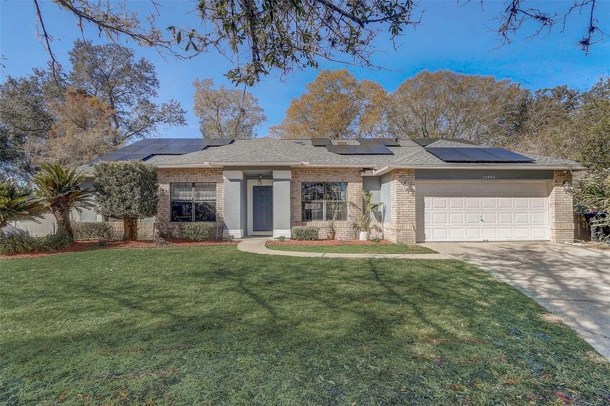 WHOLE HOUSE SOLAR! 2025 ROOF & 2022 A/C!! NO HOA!!! This 4-bedroom, 2-bathroom property is tucked away at the end of a cul-de-sac street on one of the larger lots in the neighborhood. The floor plan offers a split plan bedroom arrangement along with dual gathering areas and a large, remodeled kitchen (2024) with quartz countertops, an eat-in island & updated kitchen appliances including induction cooking. The home has amazing natural light, interior laundry, a spacious screen-enclosed lanai, and a 2-car garage with small workshop area & separate side access door for quick entry & exit. This location is approximately 1 mile to a grocery shopping plaza & convenient SR-417 interchange and approximately 3 miles to UCF and all the restaurants, shops & game day fun associated with the university area. Explore the vibrancy that borders your new Orlando address, then come back home and crank down the A/C without a second thought thanks to a low sun-powered energy bill.