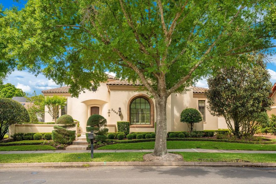 BALDWIN PARK-ORLANDO-Stunning, custom built, estate home with private pool & three car garage! NEW ATTRACTIVE PRICE!  Oversized .28 acre lot sits directly across from Union Park & Playground. Location is a 10! Welcome home to this exquisite residence featuring an expansive interior layout which boasts over 5,000 sf and features a four bedroom, four full bath, two half bath floorplan with formal dining, an executive home office, interior in-law suite, and more. Enter the home through the front gardens and step into the grand circular foyer. To the right of the foyer is the private guest wing which features an oversized bedroom, coffee bar, walk-in closet, and en-suite. The home’s main hallway with tall picture windows overlook the center courtyard will lead you past the home office and dining room, which share a beautiful double-sided fireplace, and into the heart of the home where you’ll find the kitchen and living room. French doors along one of the living room walls open to the center courtyard while French doors along the other wall open to the covered lanai and pool area. The kitchen features custom wood cabinetry, granite countertops, and Subzero Fridge and a Wolf six-burner gas range. The first floor master suite is tucked quietly away from the main living spaces and features an incredible en suite with two walk-in closets, a jetted tub, walk-in shower, dressing vanity, and separate sink vanities. Upstairs you will find two well-appointed guest bedrooms, each with their own bath, a built-in workstation and a small loft area. As stunning as the interior is, you’ll want to spend most of your time outdoors. The covered lanai features a gas fireplace, an outdoor grill with mini fridge, tv, and spectacular views of the pool – all privately hidden behind a stone wall.  Additional interior highlights include a large walk-in butler’s pantry, wood beam coffered ceilings, travertine stone flooring, first-floor laundry room, central vac, and more.