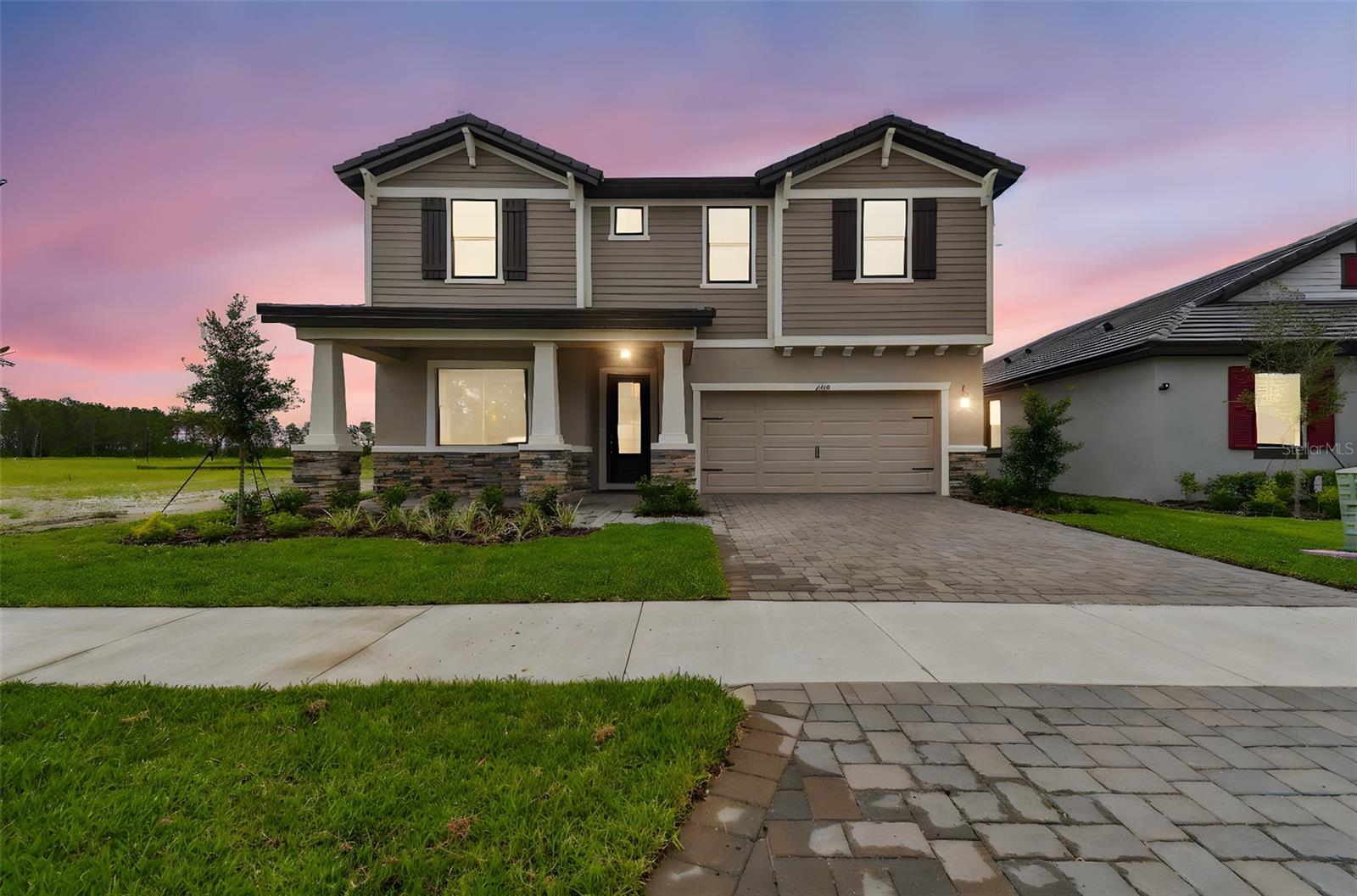 Luxury Living and location, the Juniper at Two Rivers. Step into over 3,200 sq. ft. of thoughtful design with this 5-bedroom, 4-bathroom two-story stunner, perfectly located on a premium homesite with water views in the highly desirable Two Rivers community. This home is loaded with upgrades from the moment you walk in—wood-look tile flooring, tall ceilings, and an open-concept layout that blends function and elegance. The gourmet kitchen features white shaker cabinetry with crown molding, under-cabinet lighting, quartz countertops, stainless steel appliances, and a massive center island—ideal for entertaining or everyday life. Downstairs, a private guest suite with full bath and shower offers flexibility for multi-gen living. Upstairs, the spacious owner’s suite is a true retreat with double doors, a Roman-style walk-in shower, dual vanities, and oversized closet space. Secondary bedrooms are generous and well laid out, with two additional full baths and a flexible loft space perfect for play, work, or media. Enjoy the benefits of an extended driveway, and plenty of yard space for outdoor living. Located in a lifestyle-rich, master-planned community with top-rated schools, parks, trails, and a private clubhouse, The Juniper offers the perfect blend of luxury and location. Don’t miss this opportunity. The Builder will contribute to closing costs with use of their preferred lender. ALL of the amenities are under construction and not readily available.