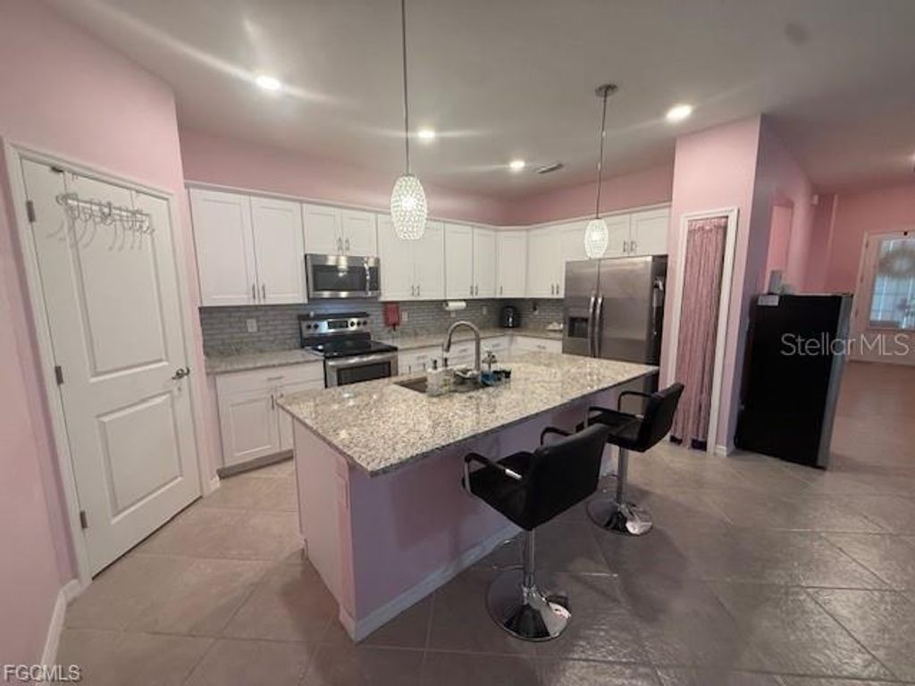 Photo of 1881 W Isles Road, Port Charlotte, FL 33953 (MLS # A4667872)