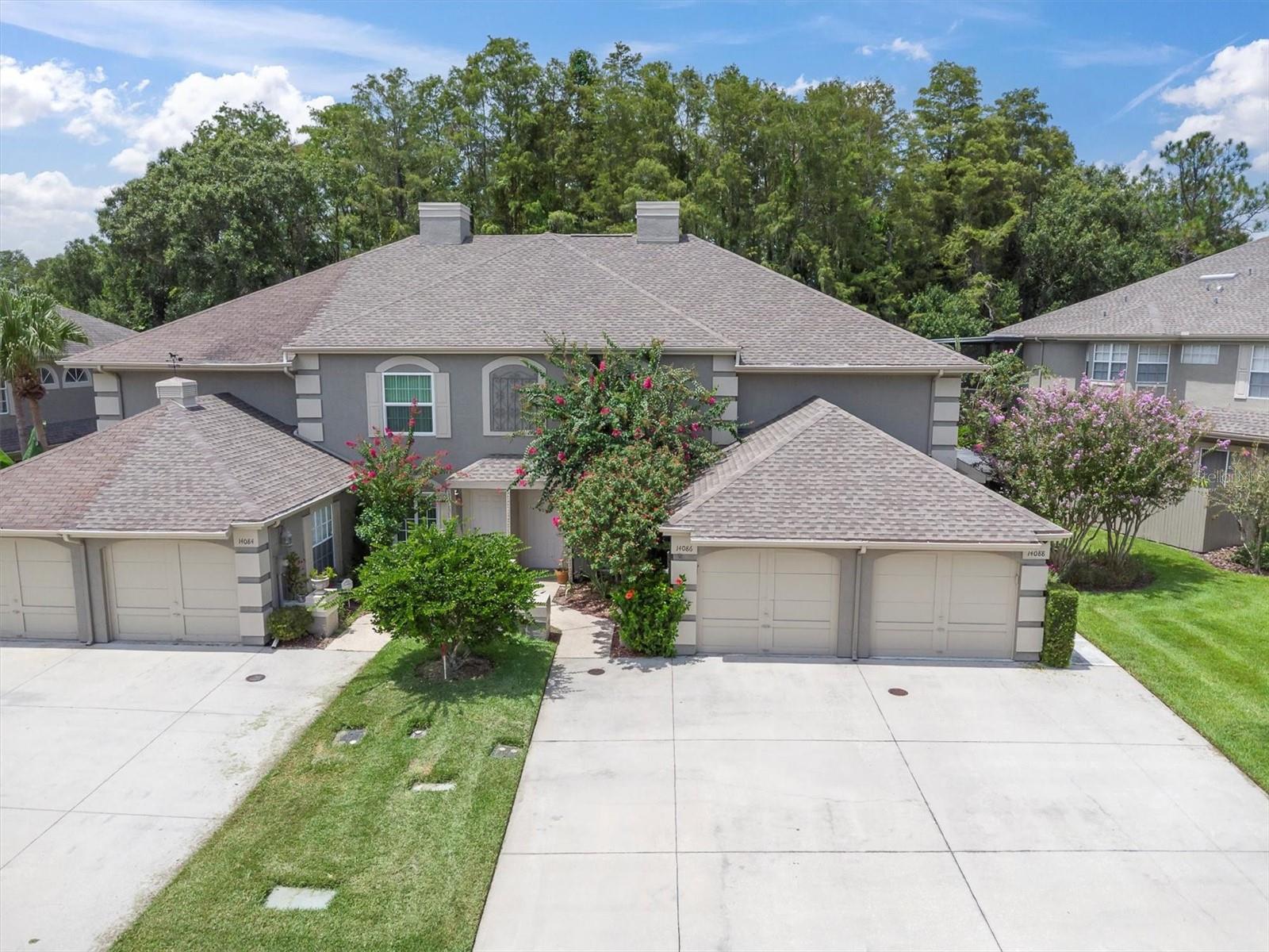 Welcome to this beautifully maintained 2-bedroom, 2.5-bath townhome nestled in the heart of sought-after Carrollwood. This spacious two-story home features a ONE CAR GARAGE plus room for additional cars in the driveway, a thoughtfully designed floor plan, and serene views of a wooded preserve — offering the perfect blend of comfort and privacy. Step inside to find a MODERN KITCHEN with GRANIT COUNTER TOPS, ideal for both cooking and entertaining. The main living area opens to a SCREENED-IN PATIO while the upstairs primary suite boasts its own PRIVATE screened-in balcony— both overlooking the tranquil natural setting. Recent updates include a NEWER ROOF AND AC (2020), providing peace of mind and energy efficiency. Enjoy community amenities like a gated SPARKLING POOL perfect for relaxing weekends or connecting with neighbors in Chardonnay. CARROLLWOOD VILLAGE amenities also include playgrounds, pickleball, tennis and basketball courts! Whether you're looking for your first home, a quiet retreat, or a low-maintenance lifestyle in a PRIME LOCATION close to Tampa International Airport, Downtown Tampa, shopping, restaurants and more, this townhome checks all the boxes. Don’t miss your chance to own a piece of Carrollwood charm!