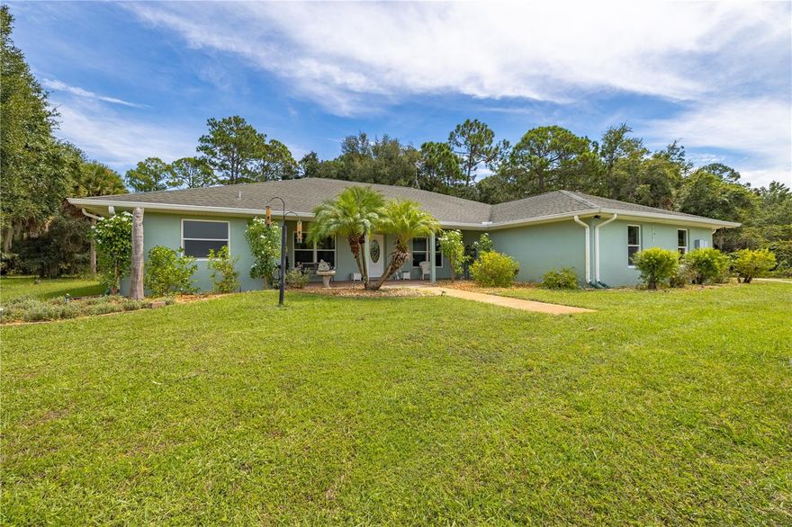 STUNNING!!!!!! A Definate must see.  3 bed 2 bath with office.  24x28 oversized 2 car garage.  Secluded living but close to town.  Private dead end road.  1200 ft circular dirve.  1/2 acre pond.  2 a/c, 2 hot water heaters.  Deluxe water system with distiller.  Sprinkler system.  Office has pond view.  Master bath has walkin shower plus jacuzzi tub.  2 walkin closests plus linen closet.  Double sinks.  Split bedroom plan.  French doors.  Ceiling fans throughout.  Vaulted ceilings in living, office and kitchen.  Tray ceiling in Master bedroom.  Plenty of room to relax.  Screened in back porch.  The 30x40 metal outbuilding is set up for automotive hobbyist.  Also a 12x40 lean-to attached.  All you would need is your hand tools.  This property has so much  that to appreciate all it has to for you MUST SEE.  PLUS a doggie yard that they can access by 2 doggie doors.