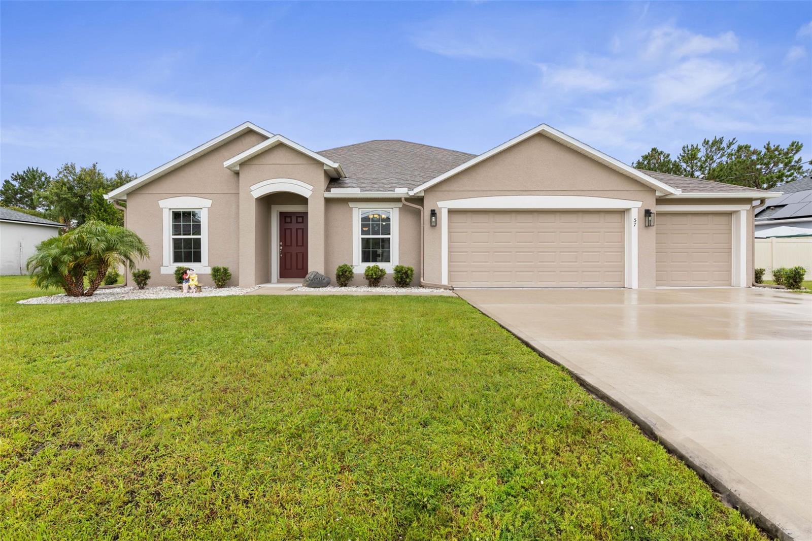 Welcome to this beautifully maintained 3-bedroom, 2-bath home at 57 La Mancha Drive offering 1,637 sq ft of comfortable living space and an array of upgrades. The bright, open floor plan features tile and carpet flooring, a spacious kitchen with 42” cabinets, and plenty of room for family and entertaining. Step outside to your private backyard retreat, complete with a sparkling inground pool with durable Shark Coating and surrounded by a vinyl privacy fence—perfect for enjoying Florida’s sunshine year-round. Additional features include a rare 3-car garage, hurricane shutters, gutters, and more. Located in a desirable Palm Coast neighborhood, close to shopping, dining, and Flagler’s pristine beaches. This home has it all—schedule your showing today!