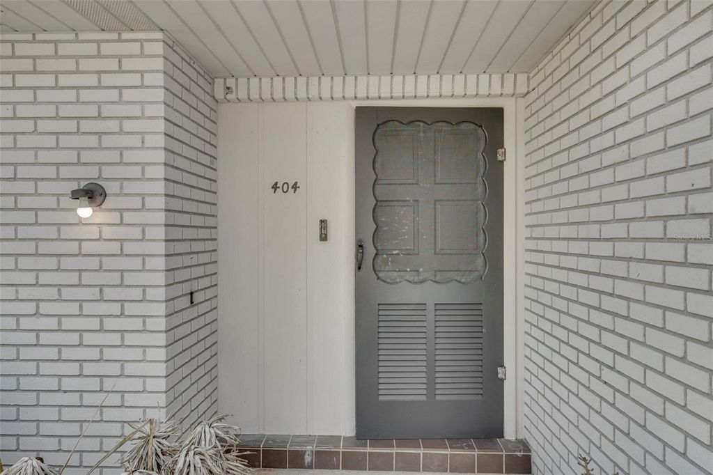 Photo of 404 Lake Ned Road, Winter Haven, FL 33884 (MLS # P4938713)