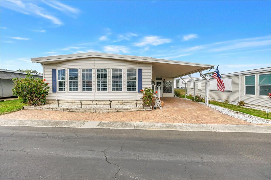 Photo of 672 Sugar Palm Street, Largo, FL 33778 (MLS # O6390074)