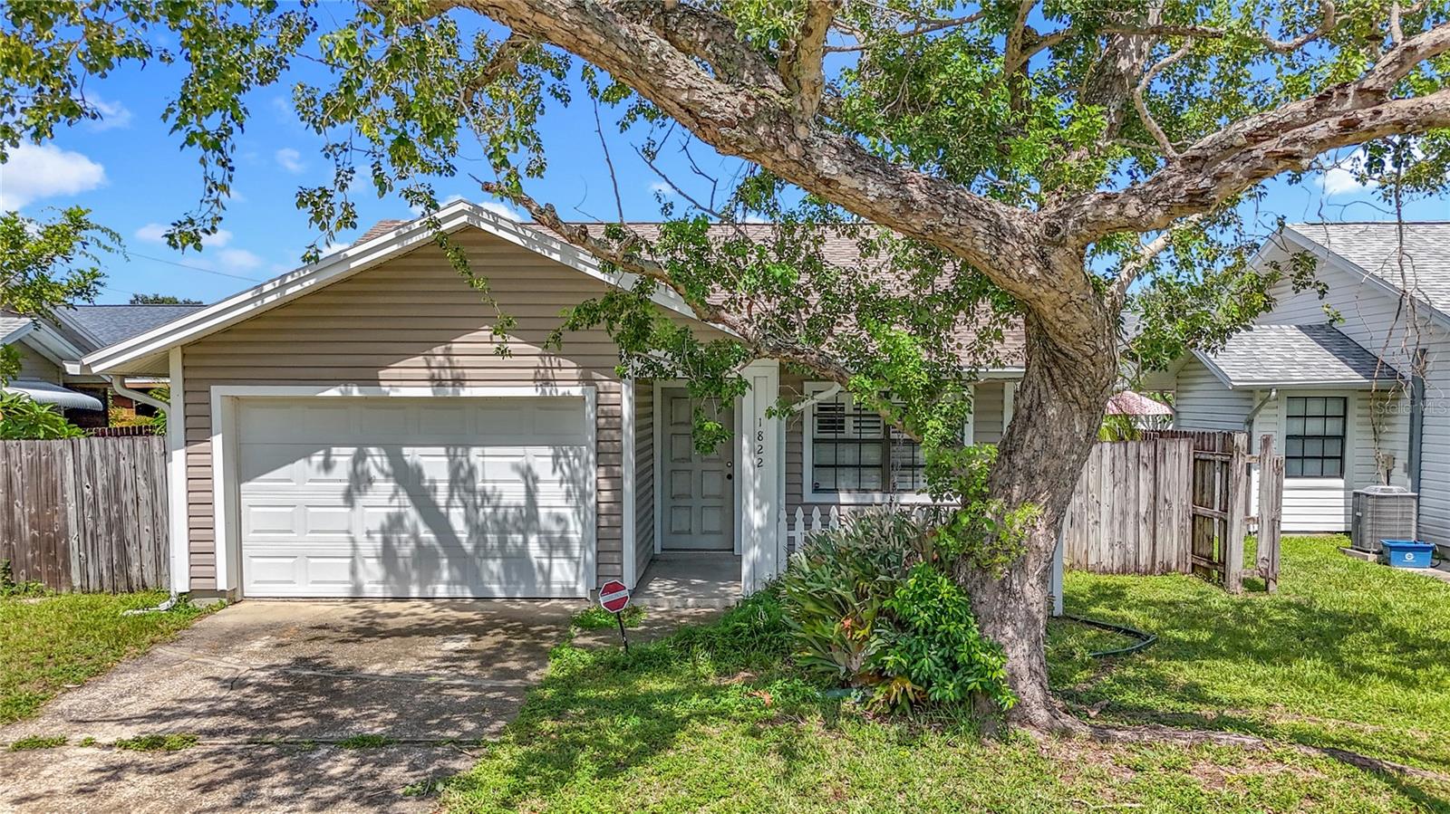 This is a lovely well kept 2 bedrooms 1 bath 1 car garage in Tall Pines. Living room with Vaulted Ceilings, Kitchen with Breakfast Bar and dinette. Sliding doors leading to side yard from the living room, Nice wood floors. Beautiful Plantation Shutters in the living room and dinette. AC 2014, Roof 2021, Newer Water Heater. Nestled in a picturesque neighborhood with a centralized location. Just minutes from shops, restaurants, parks, I-275, beaches and more, this property offers it all! Will not last long! Come make it yours before is too late!