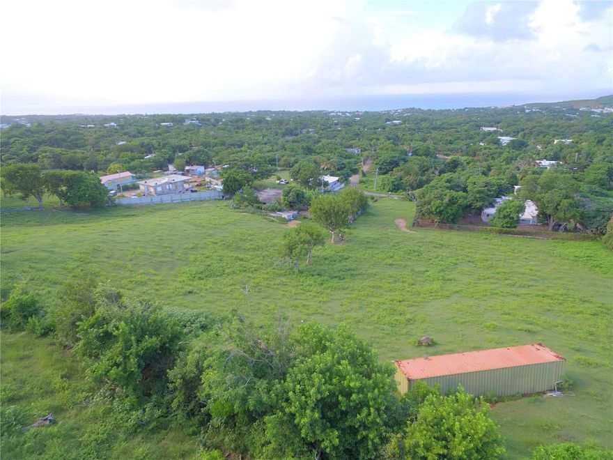 Panoramic Caribbean Views · Two Elevated Lots · Development Potential

Discover a rare opportunity in the heart of Vieques Island, Puerto Rico. This offering includes two elevated, segregated lots in the quiet La PRRA neighborhood, sold together as a single package. With a combined size of approximately 1.16 acres (.54 acres and .62 acres), these buildable parcels provide commanding views stretching from El Yunque Rainforest on the main island to Culebra and the surrounding turquoise waters of the Caribbean Sea.

From the current elevation, you can see the ferry as it arrives in Isabel Segunda and enjoy north-facing vistas that maximize daylight, breeze, and ever-changing hues of blue. The terrain is gently sloping, providing an ideal topography for designing a custom home, vacation compound, or a two-structure rental retreat. Build on one lot and keep the second as a buffer or income-generating property—or develop both for added flexibility.

Located just below the desirable Los Chivos ridgeline, the lots benefit from a middle-of-the-island location that offers quick access to grocery stores, restaurants, and the beaches of both north and south coasts. Despite its proximity to conveniences, the neighborhood remains peaceful and residential, with natural surroundings and minimal through traffic.

Utilities are available at the street, with water and electricity ready to be brought onto the land. The area is well-positioned for solar and rainwater harvesting systems as well, making it ideal for sustainable living designs.

La PRRA is one of Vieques’ neighborhoods known for elevated views and consistent breezes. Properties of this size and panoramic scope are rare in today’s market, making this a compelling option for buyers who want to create a personal Caribbean retreat or a future income-producing asset.

Whether you're looking to build a year-round residence, seasonal home, or short-term rental investment, these lots give you the space, location, and outlook to bring your vision to life.