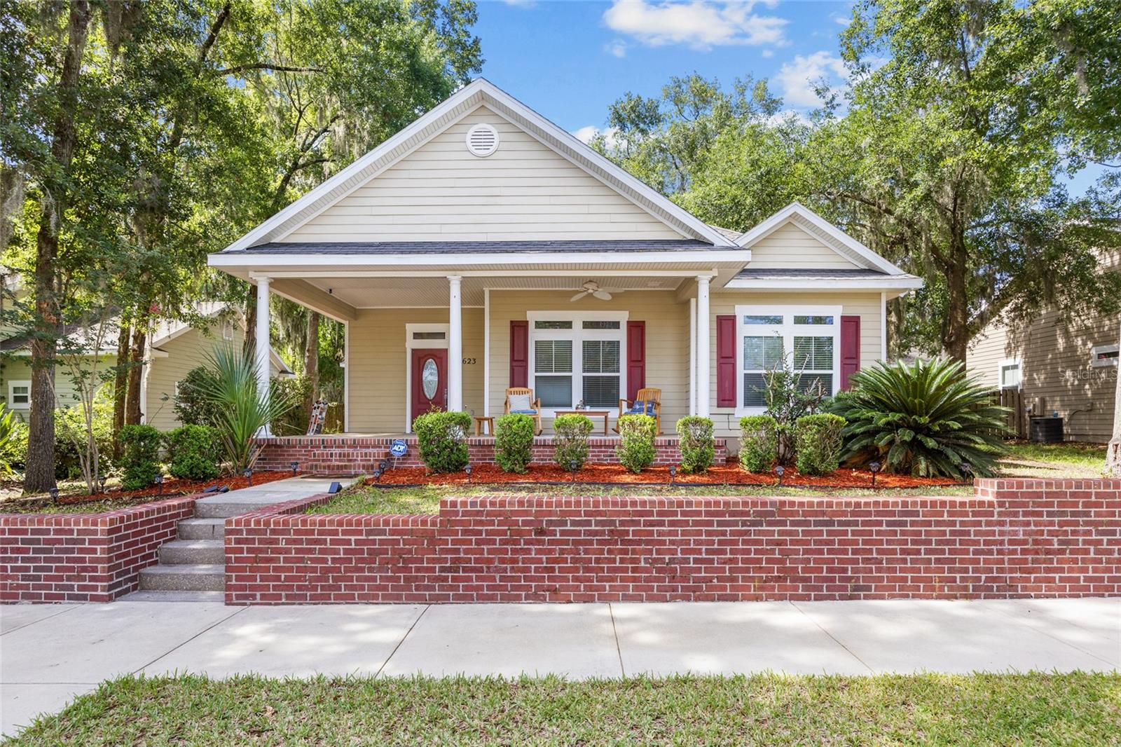 Welcome to this beautifully updated 3-bedroom, 2-bath home in the desirable Heritage Oaks community. Blending classic charm with modern touches, this residence features a timeless craftsman-style exterior and a cozy front porch perfect for relaxing afternoons. Step inside to find vinyl plank flooring, crown molding, updated baseboards, and stylish modern light fixtures. The spacious kitchen is both functional and inviting, complete with stainless steel appliances and an eat-in bar. The owner's suite is a true retreat with double vanities, a large tiled walk-in shower, and private access to the back porch and fenced yard. The attached 2-car garage includes a built-in office or gym space, ideal for today’s lifestyle needs. Should the new owners prefer to restore it for vehicle use, the seller is happy to convert it back to a traditional garage. Located in a prime neighborhood known for its welcoming atmosphere, Heritage Oaks offers sidewalks, a community playground, and unbeatable convenience—just minutes to shopping, restaurants, and I-75 for an easy commute. This move-in ready home has everything your family needs!