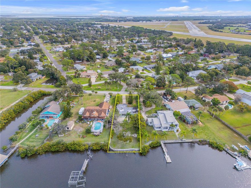 Build your dream home or reimagine a classic slice of Old Florida—either way, the true value here is the land, the water, and the location. This exceptional waterfront offering sits directly on the tranquil waters of Turnbull Bay, presenting a rare opportunity to own a deep, picturesque homesite in one of the area’s most serene coastal settings. The approximately 250-foot-deep waterfront lot provides direct water access with a quick and convenient route to the Intracoastal Waterway via the Rose Bay Bridge, making it ideal for boating, fishing, kayaking, and enjoying the surrounding natural beauty. Mature surroundings, expansive water views, and a quiet, tucked-away setting create a sense of privacy while still offering excellent access to nearby waterways and coastal amenities. Currently on the property is a modest 1950s bungalow, offering flexibility for renovation or removal. The true potential lies in the opportunity to design and build a custom waterfront residence perfectly positioned to capture panoramic water views, peaceful sunrises and sunsets, and a true Florida waterfront lifestyle. Opportunities to secure lots of this depth with direct water access are increasingly rare. Whether held as an investment or transformed into a custom coastal retreat, this property represents a unique chance to own a premier piece of waterfront land with endless potential. All information and measurements are deemed accurate but not guaranteed. Buyers and Realtors are encouraged to verify.