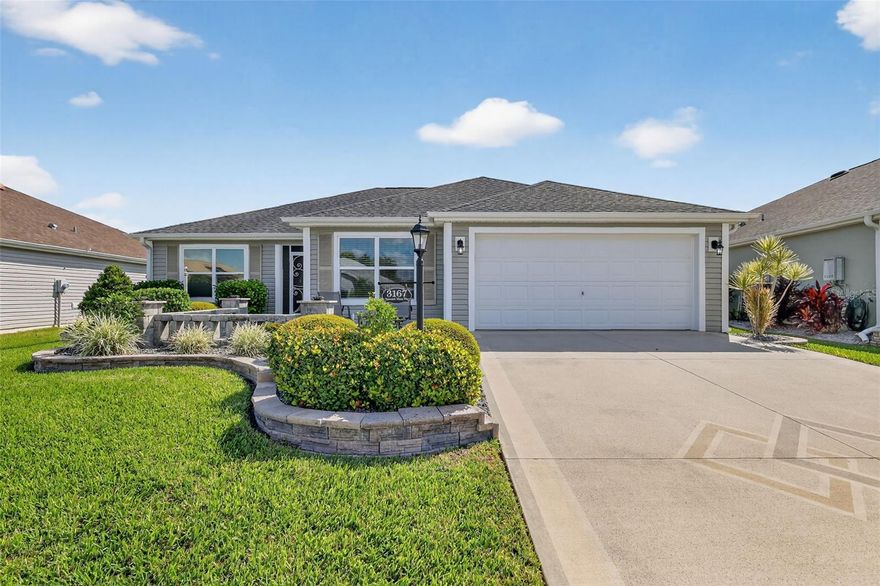 ***DESIRABLE VILLAGE OF FENNEY***BEAUTIFUL 3/2 designer home with custom designer landscape with pavers and painted driveway BUILT IN 2017 make this home most desirable The main feature is the rear fully glass enclosed lani that boasts an added mini-split A/C system which provides an extra 174 sq ft of cooled liviable space! This home has just what you're looking that features an open concept and split bedroom floor plan. VOLUME CEILINGS and DESIGNER CROWN MOLDING in the main living and kitchen areas. Solid surface designer laminate and tile flooring throughout. The kitchen boasts beautiful LIGHT CABINETRY and STAINLESS-STEEL APPLIANCES and added TANKLESS WATER HEATER make this home stunning and virtually maintenance free! The Master bedroom has a WALK-IN CLOSET! The master bathroom has separated HIS-AND-HERS SINKS and a luxurious walk-in SHOWER. The guest bedroom(s) BOTH WITH BUILT IN CLOSETS that are situated on the opposite end of the home offering privacy from the rest of the home. The desirable INDOOR LAUNDRY room includes a washer and dryer plus a utility sink. While located within the Village of Fenney that is surrounded by mature trees, scenic nature trails, and abundant amenities to include: an active lifestyle with access to golf, pickleball, putt-putt, water volleyball, water aerobics, and more! Just moments from the Regional Recreation Center, resort-style pool, and the popular Fenney Grill.  Also has easy access and commute to Highway 301, the Florida Turnpike, Route 44, and I-75, which is conveniently connected to all major central Florida hubs such as Tampa, Orlando, Ocala, and of course BEACHES! Make this your dream home and retire in style!
