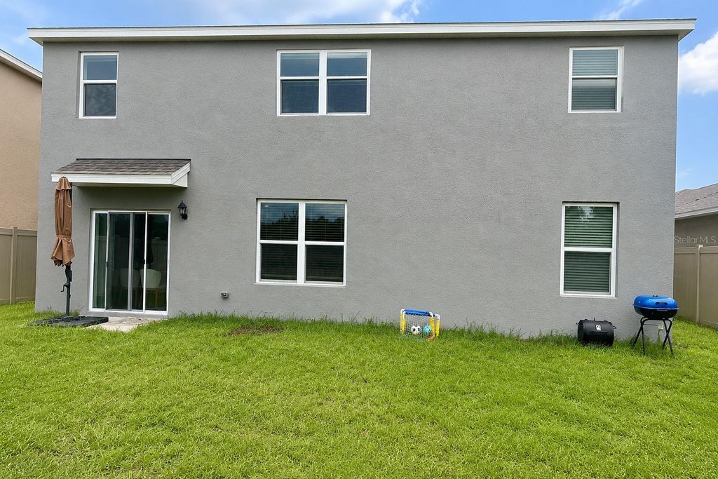 Photo of 654 Park Place Blvd, Davenport, FL 33837 (MLS # O6440431)