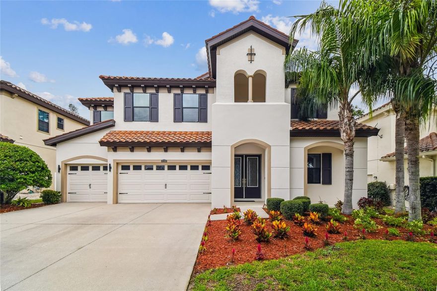 Welcome to this stunning Homes by West Bay, Mediterranean-style pool home located in the highly desirable Terra Bella community in Land O Lakes. With over $175,000 in interior upgrades in 2024 this beautiful home offers over 4,400 sq. ft of impeccably designed living space, this beautifully upgraded home features 6 bedrooms, 5 bathrooms, a home office, spacious loft, & a large bonus room—providing the perfect blend of comfort, luxury, and functionality. From the moment you arrive, you'll be impressed by the freshly painted exterior, lush landscaping, barrel tile roof, and 3-car garage with 2 new MyQ smart openers 2025 with built-in cameras.  Step inside through 8-ft double glass doors into the grand foyer with upgraded 32"x32" tile flooring that flows throughout the main level. The home features 10-foot ceilings throughout the main floor living areas, enhancing the sense of openness & elegance, while the second floor boasts 9'4" ceilings, maintaining a spacious and airy feel throughout. Just off the entry is a versatile space ideal for a formal living room or home office, complete with crown molding for a refined touch. A full bathroom with upgraded vanity, modern fixtures, & a remote-controlled toilet sits just down the hall. The formal dining room, also accented with a stunning light fixture, opens seamlessly to the home's main living areas. A show-stopping glass-railed staircase adds a sleek, modern touch to the open layout.  The grand room boasts soaring 22-foot ceilings, a designer chandelier, & flows into the fully upgraded chef’s kitchen featuring high-end KitchenAid appliances, sleek modern cabinetry, a waterfall quartz island with double-sided cabinetry and upgraded hardware, spacious butler’s pantry perfect for a coffee station, & a large walk-in pantry. The kitchen also includes ample cabinet & counter space, combining functionality with luxury. The great room includes 16ft wide pocket sliding glass doors making it ideal for indoor-outdoor entertaining. The first-floor owner’s suite is a true retreat, featuring a tray ceiling with crown molding, two large walk-in closets, and a luxurious ensuite bath complete with dual vanities, a soaking tub, and a walk-in shower. A flexible home office space and an upgraded full bath with new vanity w/ quartz counter, upgraded light fixture & a remote controlled smart bidet toilet. Upstairs, you’ll find five spacious bedrooms, each with walk-in closets, along with three full bathrooms, a large loft, and bonus room overlooking the grand room below. The second-floor laundry room includes a utility sink, and extra storage space for added convenience.  Outside, enjoy your own private oasis with a saltwater pool featuring upgraded Hayward equipment, automated waterfall system, & color-changing lights. Saltwater pool features a PebbleTec surface with a transferable lifetime warranty, and Hayward upgraded panel w/ 3yr warranty, offering peace of mind & durability. The fenced backyard provides added privacy. Additional upgrades: Lennox 4-ton, 17 seer AC unit added 7/2023, freshly painted main floor interior & exterior, all LED lighting, custom light fixtures, crown molding in the office, dining room, & owner’s suite, modern glass staircase, abundant storage, a water filtration system, & a water softener.  Located in the beautiful community of Terra Bella, residents enjoy access to a resort-style community pool and a prime location just minutes from Tampa Premium Outlets and I75.