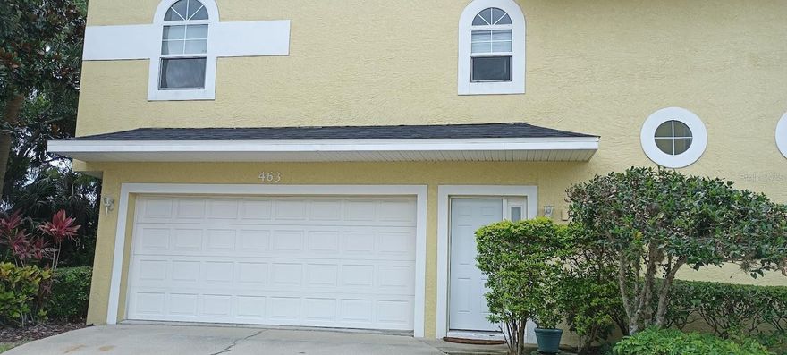 Welcome to 463 Bayou Village, a beautiful move-in ready three-story Townhome in the heart of Tarpon Springs! This property has and elevator and has been completely updated with three bedrooms, three full bathrooms and an oversized two car garage. The townhome does have a newly installed roof (2024) and a new A/C (2025) along with vinyl flooring in the living room and carpet throughout the rooms. Whether you choose elevator or the stairs when you will your way to the second floor you walk into a large open living/dining room right off the beautiful updated kitchen with granite countertops with all stainless steel appliances. Down the hall you will find your first bedroom with the bathroom across the way. This bedroom has a door that leads out to a wide balcony, which was just completely re-done (2024) which is perfect to enjoy the peaceful ambience of outside. Then on the 3rd floor we find the open loft,  the 2nd bedroom and bathroom along with the master bedroom, with it's walk-in closet and bath! This townhome has large rooms and plenty of windows to let in all the natural sunlight and there is a washer& dryer as well in the laundry closet making it super convenient. This townhome is located in the heart of Tarpon Springs, just minutes away from all the action. Whether you need to go to the grocery store, go to the gym or go out on a Friday night to attend Tarpon Spring’s First Friday event you could not ask for a better location. There are also so many amazing restaurants, breweries and boutique shops to choose from all located minutes away from you in the historic city of Tarpon Springs. Don't wait to schedule your showing today as this property may not be on the market for long.