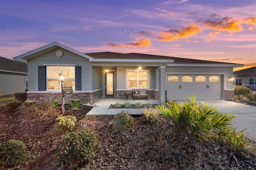 Rare find in the sought-after On Top of the World community! This private, wooded homesite showcases a beautifully maintained 2021-built Ariana floor plan offering 2 bedrooms, 2 bathrooms, a versatile flex room, and an extended 2-car garage with epoxy flooring. Charming curb appeal welcomes you into a bright foyer accented with crown molding and luxury vinyl plank flooring that flows throughout the home. To the right, French doors with CUSTOM blinds and built in cabinets,open to a flexible space ideal for a home office, den, or hobby room. To the left, a spacious guest bedroom is conveniently located near a full guest bathroom, creating a comfortable retreat for visitors. The open-concept kitchen and living area is perfect for everyday living and entertaining. The kitchen features quartz countertops, a large island with double-sided cabinetry, staggered cabinets, soft-close drawers and doors, under-cabinet lighting, a pantry, pendant lighting, and a gas range. The living area is highlighted by a tray ceiling with double crown molding and expansive panoramic windows that flood the space with natural light and offer serene wooded views. Tucked away at the rear of the home for privacy, the owner’s suite offers a tray ceiling with crown molding, a lighted ceiling fan, panoramic windows, and direct access to the lanai. The spa-inspired owner’s bath includes dual sinks with upgraded quartz countertops, a roll-in shower, and a custom walk-in closet with built-in shelving. A convenient door connects the closet directly to the laundry room. This thoughtfully designed home combines style, comfort, and functionality in a tranquil setting—perfect for enjoying the best of Florida living.