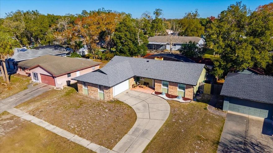 (**More Photos Coming Saturday, 1/17/26)
Welcome to 986 Turkey Hollow Circle, a beautifully cared-for 4-bedroom, 2-bath pool home tucked into one of Winter Springs’ most desirable neighborhoods, just minutes from Tuskawilla Road, SR-434, shopping, dining, and top-rated schools.

From the moment you step through the front door, you’ll feel the warmth and pride of ownership that make this house feel like home. Light, space, and thoughtful design come together in the open great room, where the kitchen, dining area, and central living space flow seamlessly—perfect for both everyday living and effortless entertaining.

The kitchen truly is the heart of the home, featuring rich cabinetry, a custom backsplash, farmhouse sink, and an expansive island with cooktop and generous bar seating. Whether you’re preparing a quiet weeknight dinner or hosting friends, this space invites connection and conversation.

Just a step down, the cozy yet spacious living room offers vaulted ceilings, recessed lighting, and beautiful tile flooring, all centered around a striking brick fireplace that adds warmth and character.

Twin sliding glass doors open the home to its private outdoor retreat, blending indoor comfort with resort-style living. Outside, warm wood-tone decking surrounds the sparkling pool and heated spa, while the impressive 10’ x 48’ covered lanai creates the perfect setting for relaxing by the fire pit, hosting poolside dinners, or enjoying Florida evenings year-round.

The private primary suite is a true sanctuary, with its own sliding glass door to the lanai and pool, a spacious bathroom, and a walk-in closet—your own peaceful escape at the end of the day. Three additional guest bedrooms sit on the opposite side of the split floor plan and share a beautifully updated bathroom with convenient pool access, perfect for family, guests, or weekend fun.

This home has been thoughtfully updated and lovingly maintained, offering both comfort and peace of mind:

Recent Updates Include:
* POOL and deck RESURFACED (2024), NEW POOL HEATER & PUMP
* New lanai flooring & updated spa lighting
* ROOF (2020)
* Updated bedroom windows (2024)
* Renovated guest bathroom with new vanity (2024)
* New recessed lighting (2024)
* Gazebo added for outdoor dining
* Pavers added for dedicated grill area
* New SS refrigerator (2023)

Warm, inviting, and designed for relaxed Florida living, this home is ready to welcome its next chapter.
(All information intended to be accurate, but not gauranteed.)