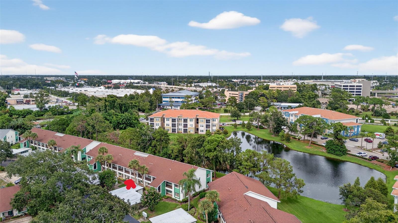 Welcome home to the highly desired community of Village on the Green. Purchase with peace of mind! This property has an elevation of over 70'. It is in Flood Zone X and a Non Evacuation Zone. The reserves are fully funded! As a two-story building, it is exempt from Milestone Inspections, impacting condos three stories and higher. Dive into paradise with this stunning 1st floor condo, perfectly nestled in a vibrant 55+ community! Your gorgeous condo has an updated eat in-kitchen with beautiful tile flooring. The living area is large and includes a dining area adjacent to the living room. From the living room you have a large, secluded, pond view, screened Lanai, perfect for your morning coffee, afternoon reading and evening refreshments. The primary suite is large with a walk in closet and en-suite bathroom with a walk in shower. The perks don't stop there! This community is a lifestyle, not just a location. Enjoy a sparkling pool, a clubhouse with a fitness center, library, card room and banquet room. Outside you will find the shuffleboard courts and community picnic area complete with gas grills for residence use. The clubhouse offers card playing and board game groups of all kinds as well as a shuffleboard group that meets weekly in the fall through the spring. Additionally there are regular community events throughout the year. Your condo fees include, water, sewer, trash, cable tv and internet in addition to all of the exterior maintenance and common area maintenance. And the best part, you're just minutes away from the heart of vibrant Downtown Dunedin, with its charming shops, delectable dining, and lively entertainment. Plus, you’re close to Honeymoon Island, Caladesi Island and more of Florida’s best beaches and fun activities. This condo offers you peace of mind and fun in the sunshine. Don’t just dream of the Florida lifestyle – live it!