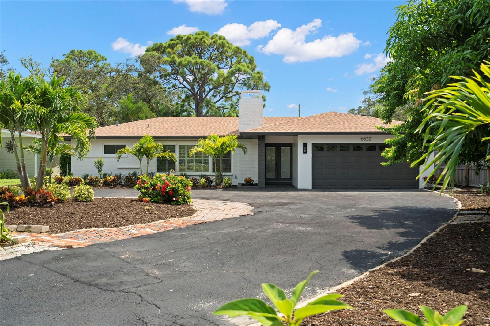 Just Renovated Pool Home in St. Pete — Welcome to 6522 Flamingo Way S, a beautifully renovated coastal retreat in sunny St. Petersburg, FL. 5 minutes to St Pete Beach, 10 minutes to downtown St Pete. This stunning home offers the perfect blend of modern upgrades, Florida charm, and prime waterfront living — Airbnb allowed. Highlights you’ll love: Sparkling pool with screened cage — sun, yes. Leaves, no. Pool system works for both chlorine and salt. Private dock with creek access to the Intracoastal, plus a ramp for paddle boards and kayaks. Fruit trees galore — star fruit, mango, avocado, pineapple, and banana right in your backyard. New landscaping, deck, and fence for a fresh, move-in-ready look. Big oversized lot with huge driveway and spacious 2-car garage. Inside, discover: Bright, open living spaces with plantation shutters and a built-in closet system. Gourmet island kitchen, a beverage fridge, and modern finishes. Smart home features: garage door and thermostat controllable from your phone, plus a garage camera. Hurricane shutters for peace of mind. Outdoor lifestyle perks: Covered front entry— keeping your Amazon packages dry during Florida’s daily summer showers. Outdoor shower for rinsing off after the pool or paddle boarding. NO FLOODING NEVER FLOODED