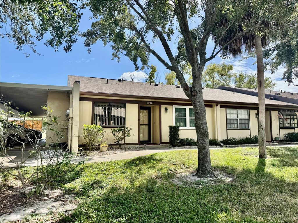 Photo of 11231 Dollar Lake Drive #1, Port Richey, FL 34668 (MLS # L4956369)