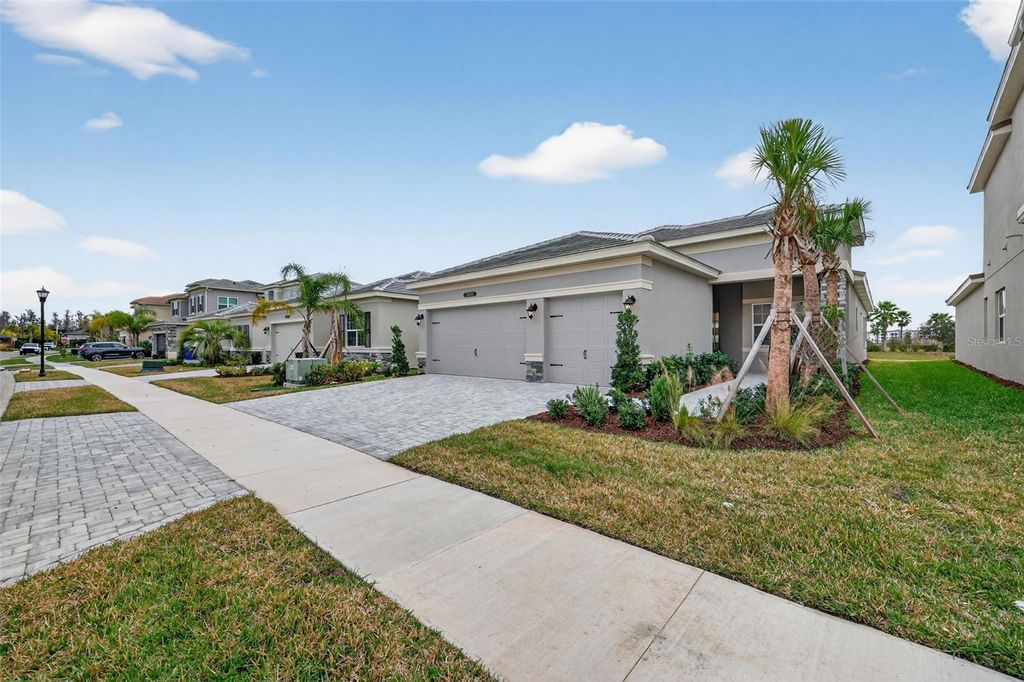 Photo of 32268 Mahogany Valley Drive, Wesley Chapel, FL 33543 (MLS # TB8465125)