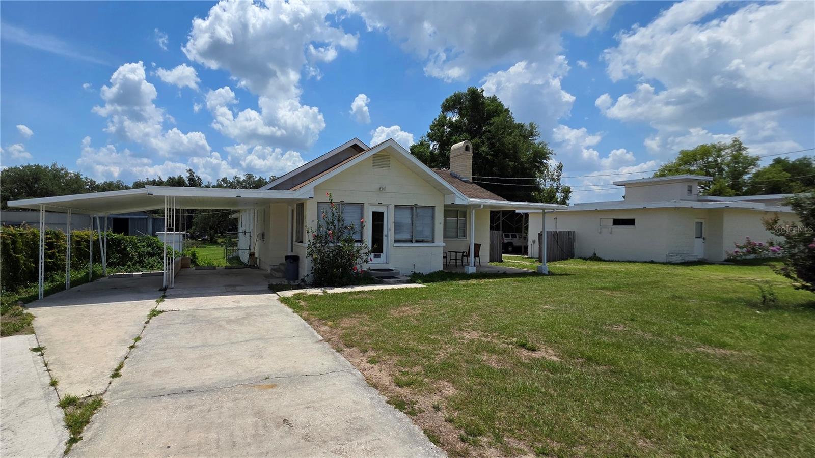 Rare 2.55-Acre Multi-Use Opportunity in the Heart of Dade City – Live, Work, or Develop
Unlock endless potential with this unique 2.55-acre property zoned RIO (Residential, Institutional, Office)—perfect for living where you work, launching a business, or creating income-generating units. The main residence is a 3-bed, 1.5-bath classic "Ocala block" home featuring a wood-burning fireplace, solid wood kitchen cabinets, vinyl and tile flooring throughout, and a sun-filled Florida room.
The property is fully enclosed with 6’ commercial-grade chain-link fencing and includes multiple outbuildings. A 2,616 sq ft former meat processing facility offers 3 walk-in coolers, office space, and warehouse storage. A separate 2,160 sq ft detached garage/workshop includes a half bath and is ideal for car enthusiasts, contractors, or additional storage.
Located inside Dade City limits with city water and sewer, this property is just steps from a high school, two blocks from the hospital, and on a public bus route. Zoned for up to 19 residential units an acre, it's an incredible opportunity for development—apartments, townhomes, duplexes, triplexes, or a multi-generational compound.
Whether you're a developer, entrepreneur, or visionary homeowner—this property delivers flexibility, space, and long-term value.