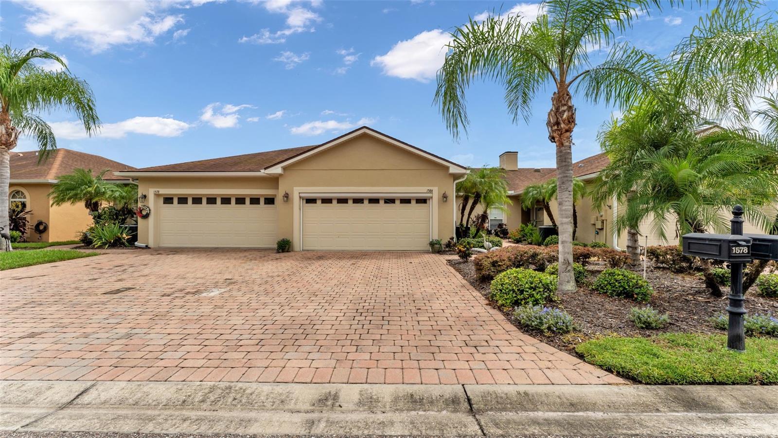 Welcome to your dream home in the serene 55-plus gated community of Vienna Square in Winter Haven! This exquisite 2-bedroom, 2-bathroom villa is designed for comfortable living and entertaining, featuring an inviting open floor plan that welcomes you with warmth and style. As you step inside, you'll appreciate the spacious layout where the dining room and living room seamlessly combine, creating an ideal space for family gatherings and social events. The heart of the home, the large kitchen, boasts stunning granite countertops, modern stainless steel appliances, a generous pantry, and ample cabinetry to meet all your culinary needs. Whether you're hosting a dinner party or enjoying a quiet evening in, this kitchen is a true delight. The primary bedroom is a serene retreat, complete with an ensuite bathroom that offers both luxury and convenience. Enjoy the convenience of a separate vanity and indulge in the refreshing walk-in shower that provides a spa-like experience. The second bedroom is versatile and is located conveniently next to the second bathroom, making it perfect for guests or family visits. An added bonus to this villa is the additional room off the living area, which can serve as a cozy office, a game room for fun nights with friends, or a peaceful reading nook—tailored to fit your lifestyle. Outside, the well-maintained exterior ensures you can spend more time enjoying the community rather than worrying about upkeep. The monthly HOA fees cover exterior paint, roof maintenance, yard care, irrigation water, and even a Spectrum TV/Internet package, allowing you to relax and enjoy your new home without the stress of added responsibilities. Residents of Vienna Square can take pleasure in an active lifestyle with access to a vibrant clubhouse, a refreshing pool, and well-maintained tennis courts. This gated community also offers the convenience of being located near major retailers and a variety of restaurants, ensuring you’re never far from everything you need. Move-in ready and designed for low maintenance, this villa represents the perfect blend of comfort, luxury, and convenience in the coveted Vienna Square. Don’t miss your chance to experience the joyful lifestyle this community has to offer!