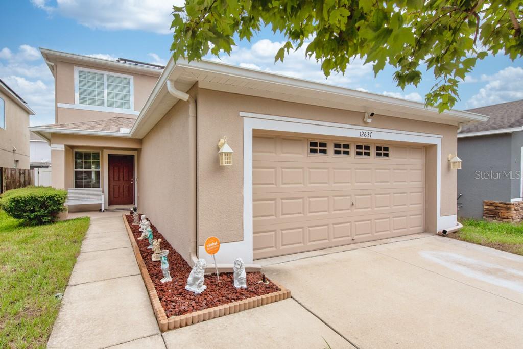 Rare Opportunity – 3.5% Assumable VA Loan! Solar-Powered Home in Panther Trace. Welcome to Panther Trace, one of Riverview’s most desirable communities! This spacious 2-story Standard Pacific “Remington” Solar Home offers 4 bedrooms, 2.5 bathrooms, a 2-car garage, and water views, blending comfort, efficiency, and convenience. Step into the inviting foyer where the living room flows seamlessly into the dining area and open kitchen. The kitchen features a center island, pantry closet, and ample cabinet space, with glass sliders leading to the covered lanai and fully fenced backyard complete with a full concrete perimeter path—perfect for entertaining or enjoying peaceful evenings outdoors. The primary suite is located downstairs and features, tray ceilings, a walk-in closet, and an en-suite bath with dual sinks and a glass shower. A half bath and laundry room complete the main level. Upstairs, you’ll find three generously sized secondary bedrooms with vaulted ceilings, a shared full bath, and a large loft area ideal for a home office, media room, or playroom. This home is loaded with valuable upgrades, including a solar energy system that keeps electric bills around $40/month, a Vivint security system, fresh interior and exterior paint, new 15-SEER A/C unit (2024), fenced yard, gutters, and full concrete walkway surrounding the home. Panther Trace residents enjoy resort-style amenities, including a clubhouse, community pool, playground, tennis courts, and basketball courts. With easy access to I-75, US-301, and the Selmon Expressway, you’re minutes from schools, shopping, dining, downtown Tampa, Tampa International Airport, and MacDill Air Force Base. Don’t miss your chance to own this energy-efficient, move-in ready home with a rare 3.5% assumable VA loan—schedule your private showing today!