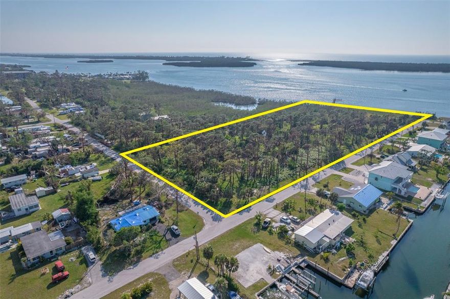PRIME WATERFRONT MULTIFAMILY Development Opportunity! 6 acres located on Lemon Bay, opposite Stump Pass with direct access to the beaches & pull-up restaurants close to Manasota Key. PRE-PAID IMPACT FEES, zoned RMF 10 & RMF 5, possible 43 units development. NEW SEA WALL, concept plans for condos & tiny homes developments available, as well as Phase 1 due diligence. Multi-access to highways including I-75,  and to Punta Gorda & Ft Myers airports. Fast access to SR-41. Located in America's #7 entrepreneurial ecosystem: high growth Charlotte County (tax abatements, expedited permitting, Opportunity Zone: capital gains waivers).