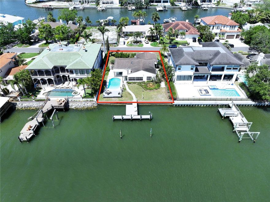 Drastic Price Reduction.  A wonderful opportunity to build your dream home in one of Tampa’s most prestigious neighborhoods, Sunset Park Isles.  The home was completely remediated following Hurricane Helene and is being sold AS IS.  This expansive 85’ x 130’ lot is nestled within one of South Tampa’s most coveted multimillion-dollar neighborhoods.  The lot sits on one of the widest and deepest canals in South Tampa.  A boater’s paradise, you will not have to wait for high tide to go boating!  Enjoy sunsets and breathtaking views of the bay on the 460 square foot dock, which can easily accommodate up to a 50-foot yacht.  Sunset Park Isles is a No HOA and No CDD neighborhood.  The home lies within the A-rated school district Mabry Elementary, Coleman Middle, and Plant High School district.  Close to Tampa International Airport, International Mall, Downtown Tampa, professional sports venues, Hyde Park Village, Bayshore Boulevard, MacDill Air Force Base, numerous high-end restaurants, and major roadways.  This is your chance to live in one of the most desirable luxury waterfront neighborhoods in South Tampa.  Schedule your private showing today.