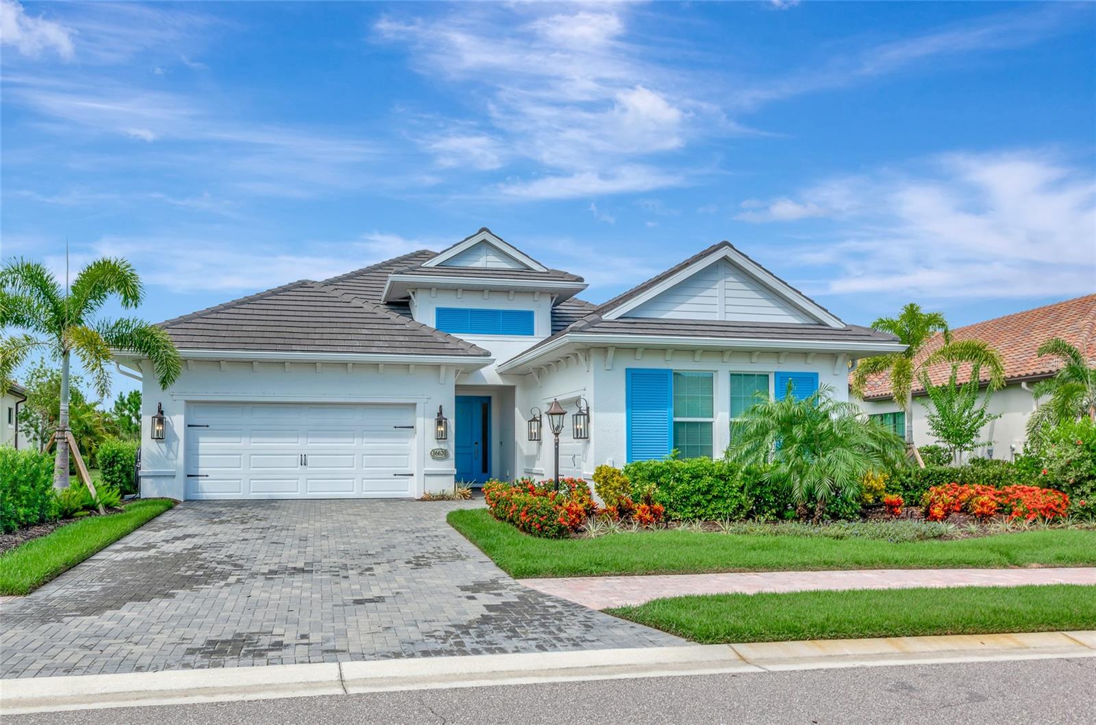 Exquisite Luxury Living in Country Club East. Welcome to this stunning residence, offering the rare combination of pristine condition, high-end finishes, and a prime location within one of Lakewood Ranch’s premier gated communities. Built in 2021 and thoughtfully upgraded in 2022 and 2024, this residence shows like a model and has been maintained to the highest standards.
From the moment you enter, the quality is unmistakable. A wide gallery hallway with dual coffered ceilings and elegant chandeliers sets the tone, leading you directly to the preserve view beyond. The open layout was designed for both comfort and functionality, with expansive windows throughout that flood the home with natural light and frame the lush landscape from nearly every room.
The gourmet kitchen is a standout, featuring top-of-the-line Wolf and Bosch appliances, deep drawer cabinetry, a generous walk-in pantry, and an oversized island that anchors the space. The adjoining great room is ideal for both entertaining and everyday living, with seamless access to the outdoor area and unbroken views of vibrant flowering trees and shrubs.
The owner's suite is a private retreat, offering lanai access, preserve views, and a spacious spa-style bath with dual vanities, an oversized walk-in shower, and a custom closet that connects directly to the laundry room for added convenience. Two guest bedrooms are thoughtfully located in their own wing, sharing a well-appointed bathroom that ensures privacy and comfort for visitors. A versatile flex room provides additional space for a home office, media lounge, or studio.
Step outside to enjoy a true Florida lifestyle. The oversized saltwater pool (12' x 27') and elevated spa are surrounded by mature landscaping for maximum privacy, while the covered lanai includes a fully equipped Lynx outdoor kitchen—perfect for entertaining or unwinding at the end of the day.
Additional highlights include an oversized two-car garage plus a separate third bay, ideal for a workshop, gym, or golf cart storage. Wide-plank white oak floors, custom wood ceiling treatments, and quality finishes run throughout, reflecting the level of care and craftsmanship typically reserved for much more expensive homes.
Don’t miss out on this extraordinary home which is set within a maintenance-free section of Country Club East where lawn care is included. Why wait to build when you can move right into a like-new home that checks every box? Schedule your private showing today.