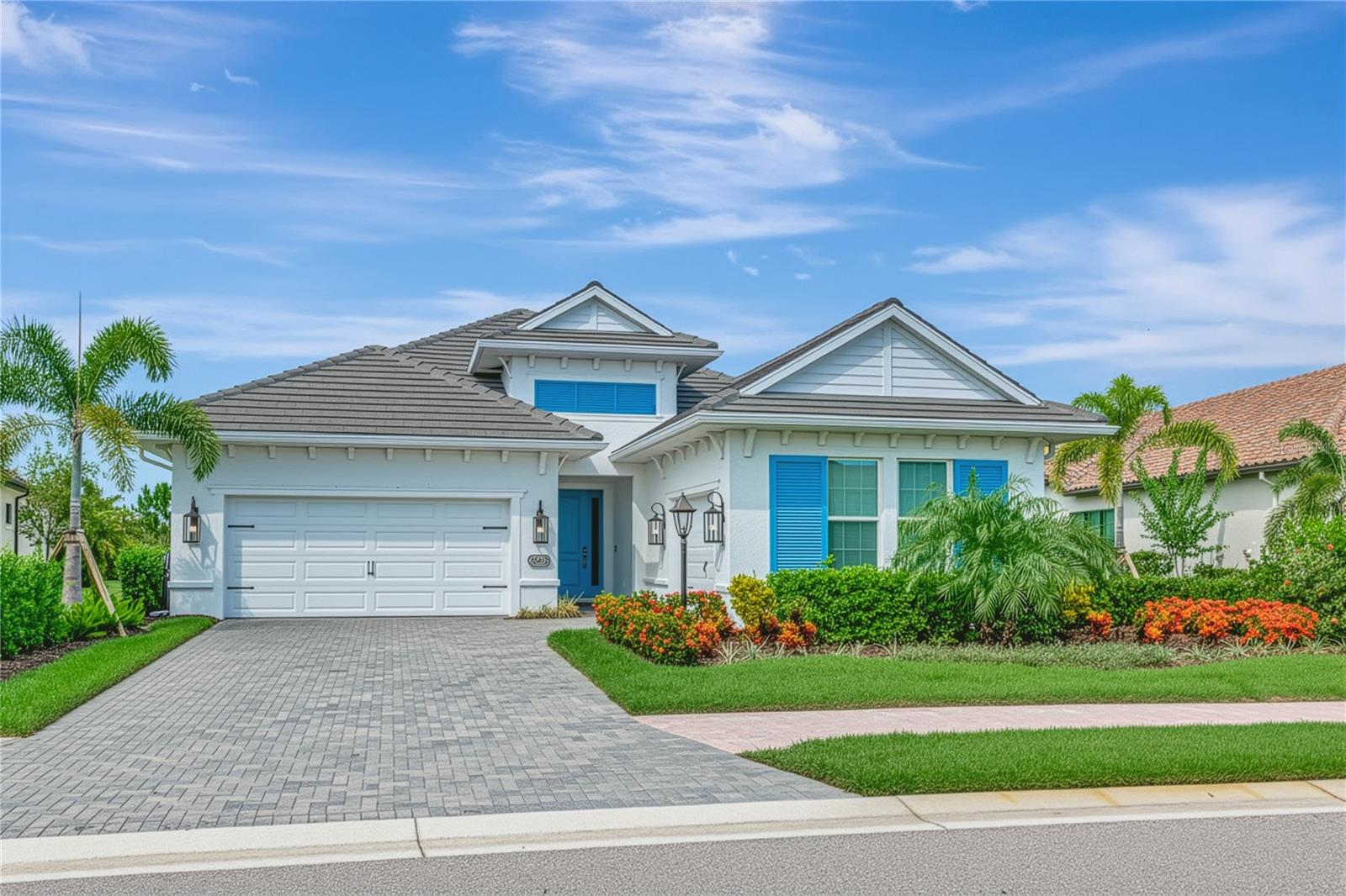Exquisite Luxury Living in Country Club East. Welcome to this stunning residence, offering the rare combination of pristine condition, high-end finishes, and a prime location within one of Lakewood Ranch’s premier gated communities. Built in 2021 and thoughtfully upgraded in 2022 and 2024, this residence shows like a model, has ***IMPACT WINDOWS and DOORS*** on both the front and rear of the house and has been maintained to the highest standards.
From the moment you enter, the quality is unmistakable. A wide gallery hallway with dual coffered ceilings and elegant chandeliers sets the tone, leading you directly to the preserve view beyond. The open layout was designed for both comfort and functionality, with expansive windows throughout that flood the home with natural light and frame the lush landscape from nearly every room.
The gourmet kitchen is a standout, featuring top-of-the-line Wolf and Bosch appliances, deep drawer cabinetry, a generous walk-in pantry, and an oversized island that anchors the space. The adjoining great room is ideal for both entertaining and everyday living, with seamless access to the outdoor area and unbroken views of vibrant flowering trees and shrubs.
The owner's suite is a private retreat, offering lanai access, preserve views, and a spacious spa-style bath with dual vanities, an oversized walk-in shower, and a custom closet that connects directly to the laundry room for added convenience. Two guest bedrooms are thoughtfully located in their own wing, sharing a well-appointed bathroom that ensures privacy and comfort for visitors. A versatile flex room provides additional space for a home office, media lounge, or studio.
Step outside to enjoy a true Florida lifestyle. The oversized saltwater pool (12' x 27') and elevated spa are surrounded by mature landscaping for maximum privacy, while the covered lanai includes a fully equipped Lynx outdoor kitchen—perfect for entertaining or unwinding at the end of the day.
Additional highlights include an oversized two-car garage plus a separate third bay, ideal for a workshop, gym, or golf cart storage. Wide-plank white oak floors, custom wood ceiling treatments, and quality finishes run throughout, reflecting the level of care and craftsmanship typically reserved for much more expensive homes.
Don’t miss out on this extraordinary home which is set within a maintenance-free section of Country Club East where lawn care is included. Why wait to build when you can move right into a like-new home that checks every box? Schedule your private showing today.